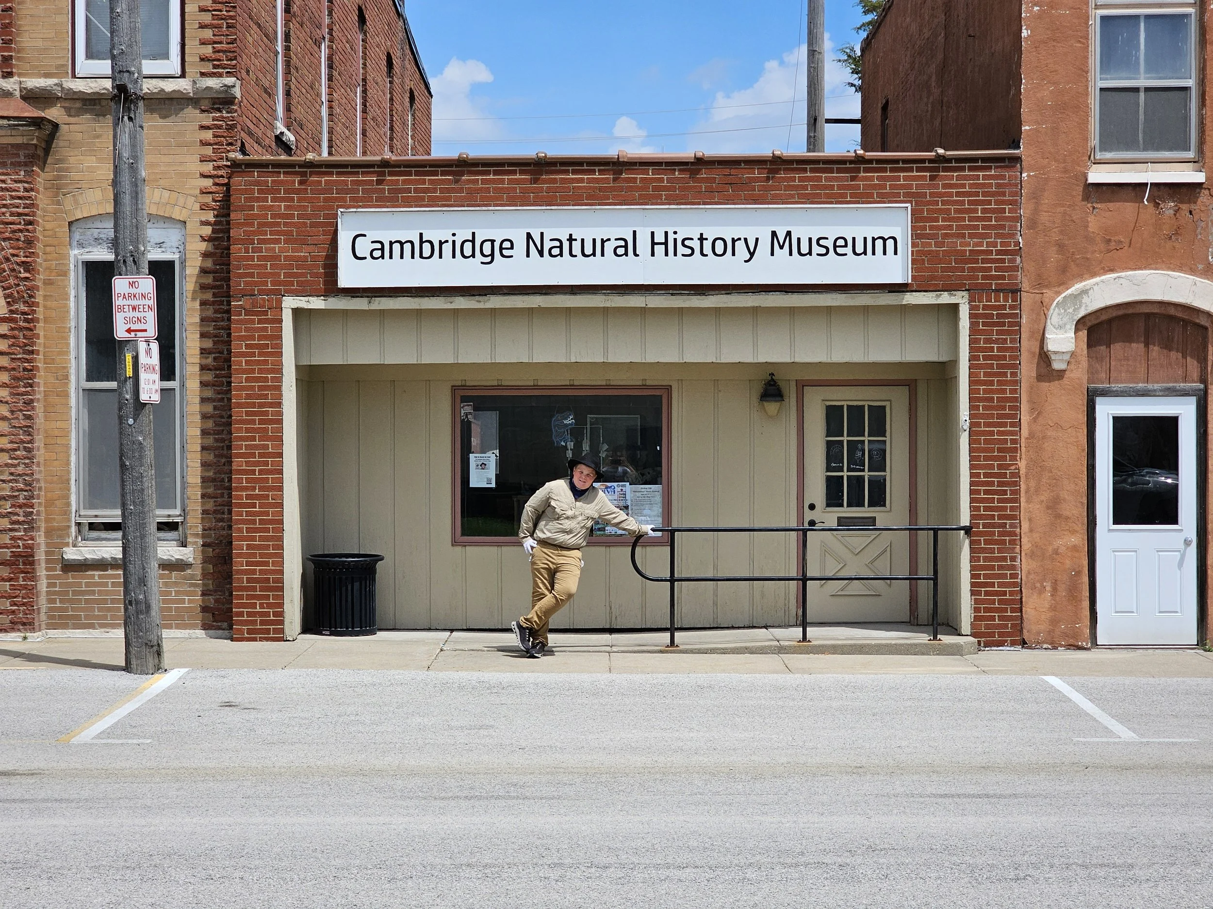 Anderson Taylor outside the Cambridge Natural History Museum storefront.
