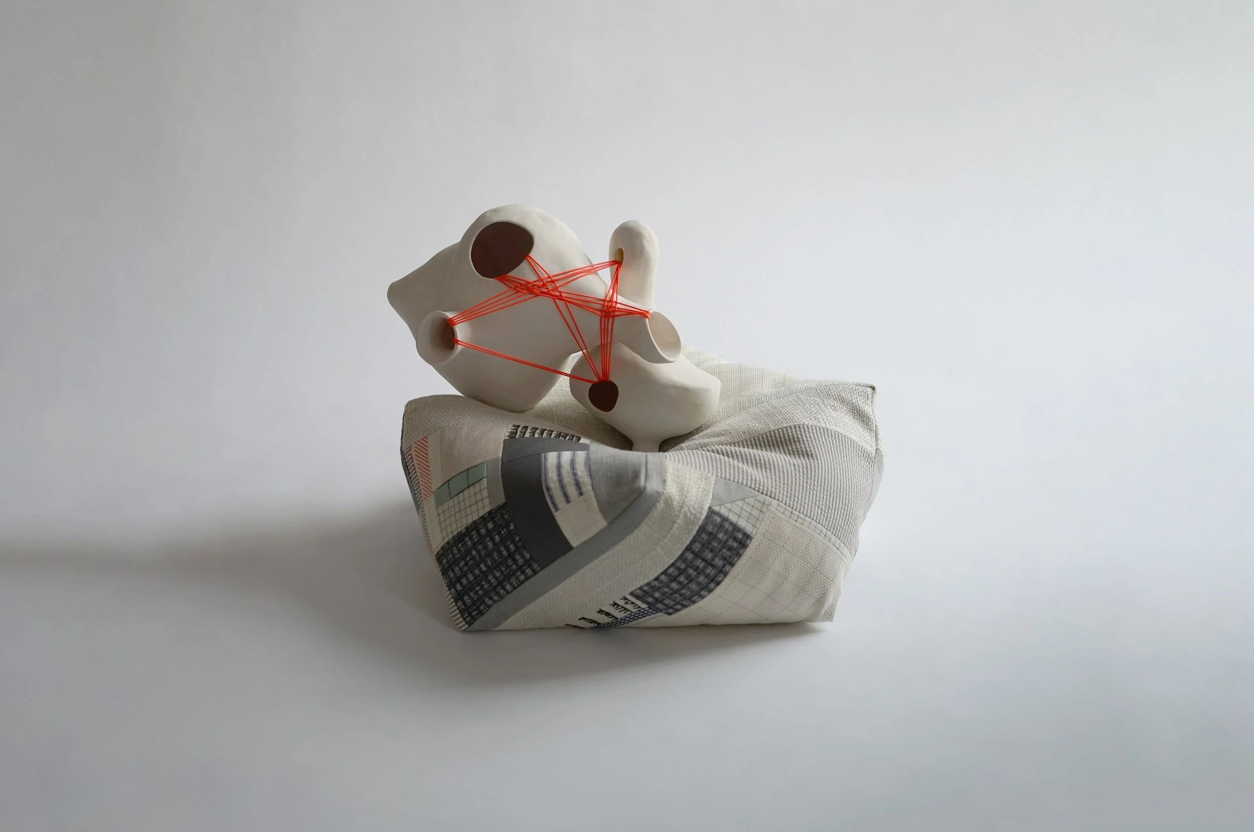 Untitled #2.
Porcelain/ cotton and linen remnants/kapok, nylon twine.