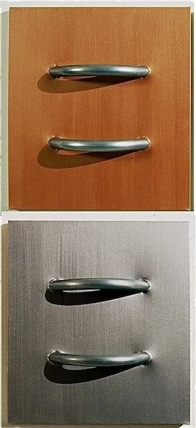 Two cabinets, one with a brown door and one with a gray door, each with two silver handles.