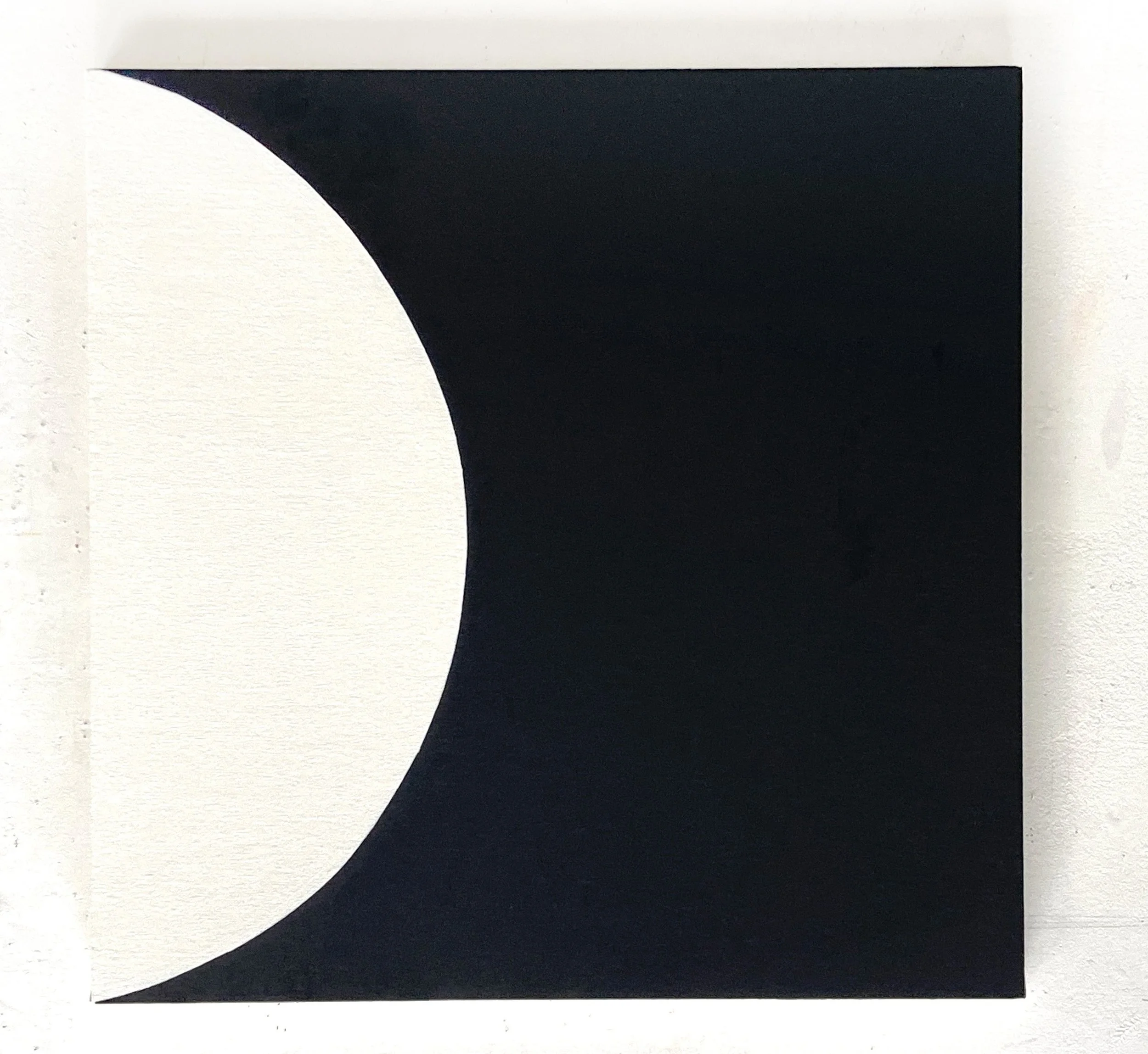 Close-up of a black and white geometric abstract art piece with sharp contrast and clean lines.