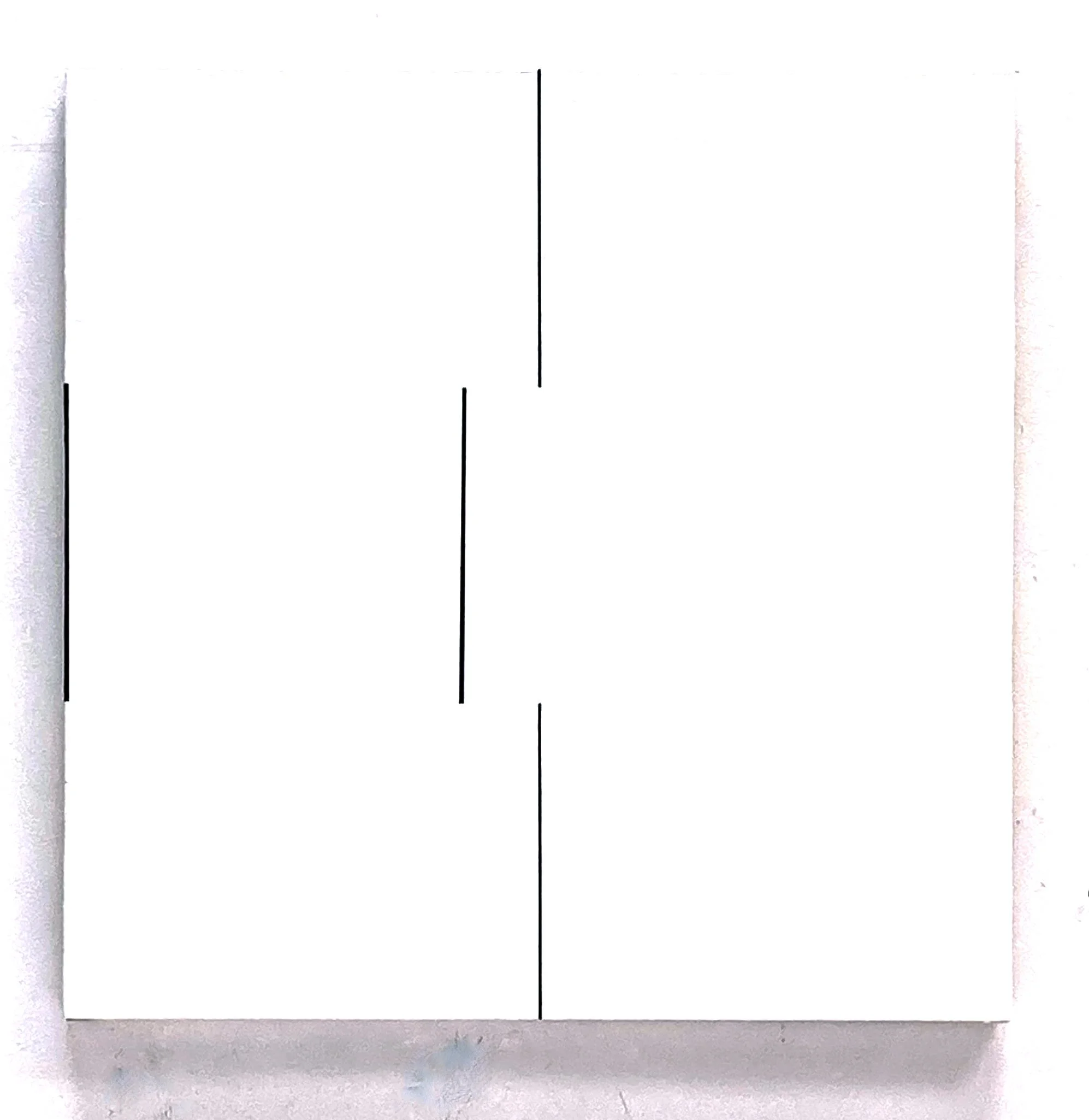 White grid paper with a black vertical line and a black horizontal line, placed on a white surface.