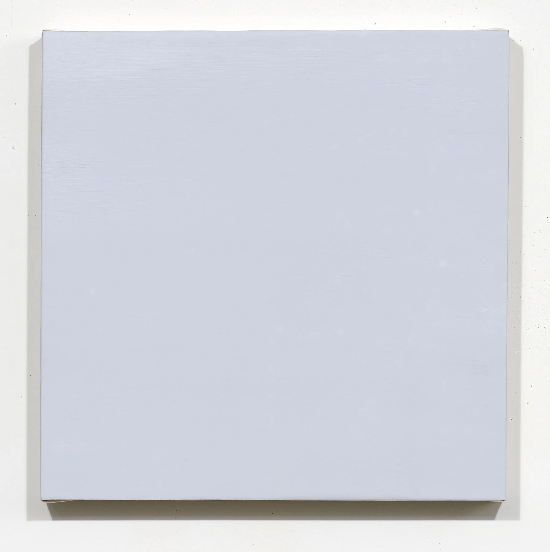 A plain white, closed box with a slightly textured surface, seen from above on a white background.