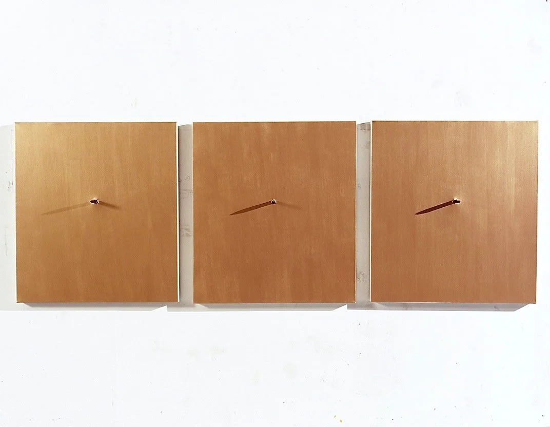 Three wooden clocks with black hour hands on a white background.