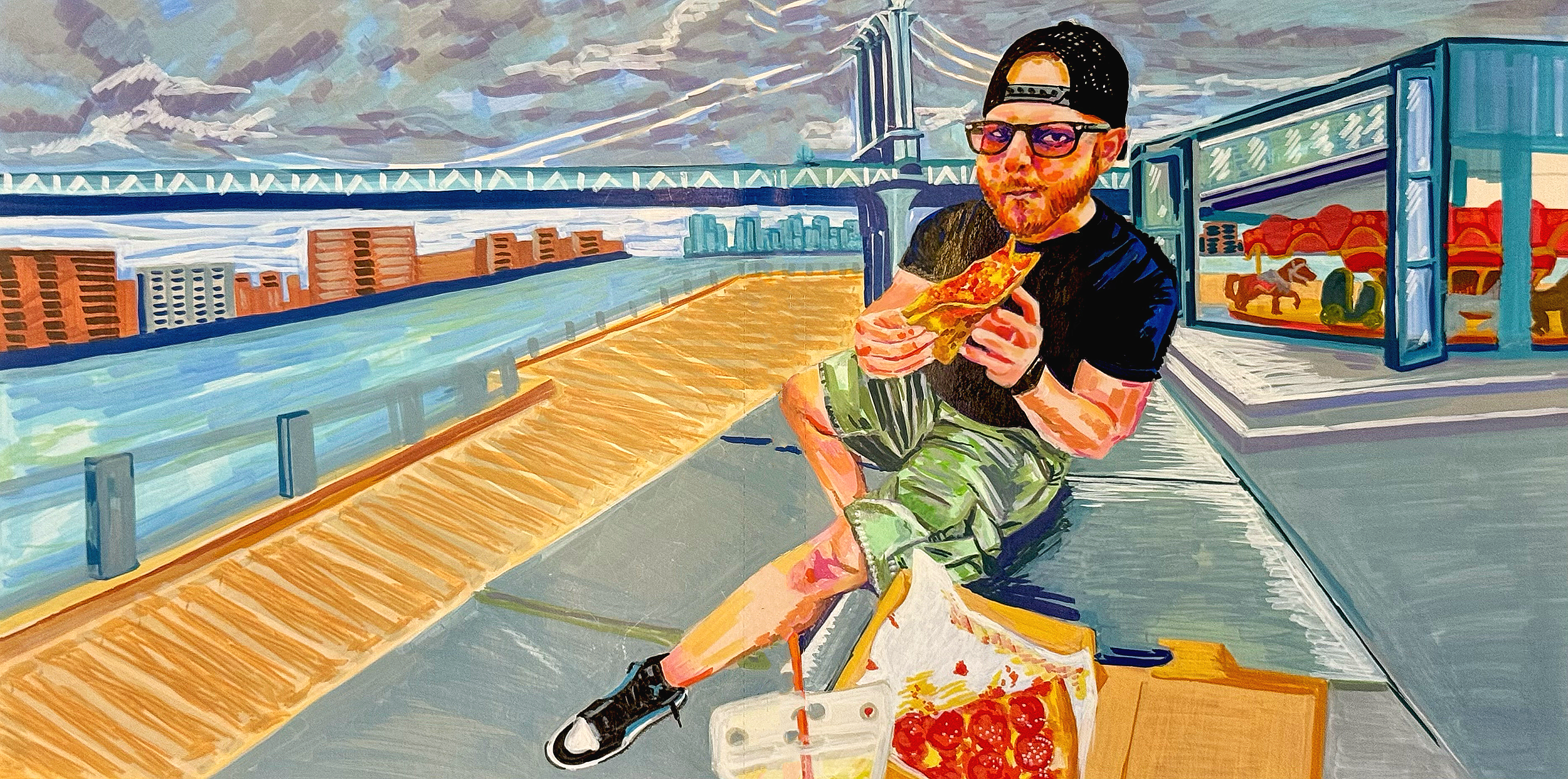 A man with glasses and a cap sitting on a bench on a rooftop, holding a slice of pizza, with a cityscape and a bridge in the background. There is a tray of cherry tomatoes and a drink in front of him.