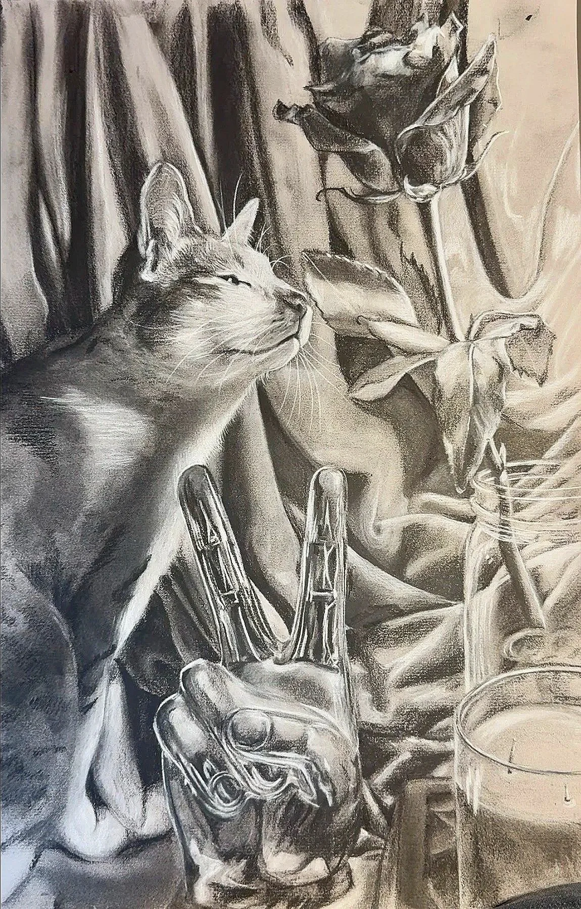 A detailed black and white drawing of a cat with closed eyes, sitting among a draped fabric and a large sunflower. A hand holding a spray bottle is spraying the cat, which appears to be relaxed.