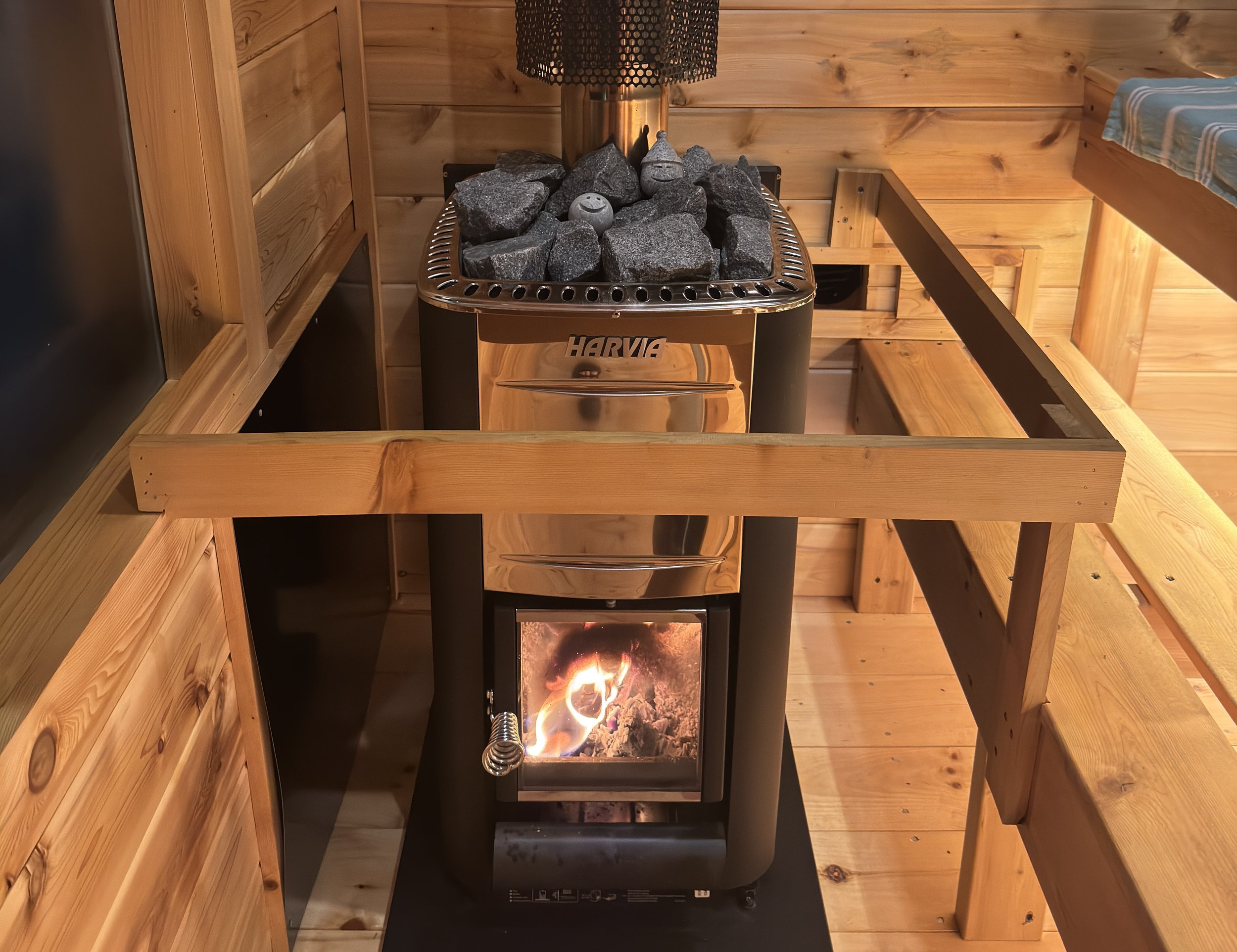 Wood burning sauna stove, looking beautiful at night