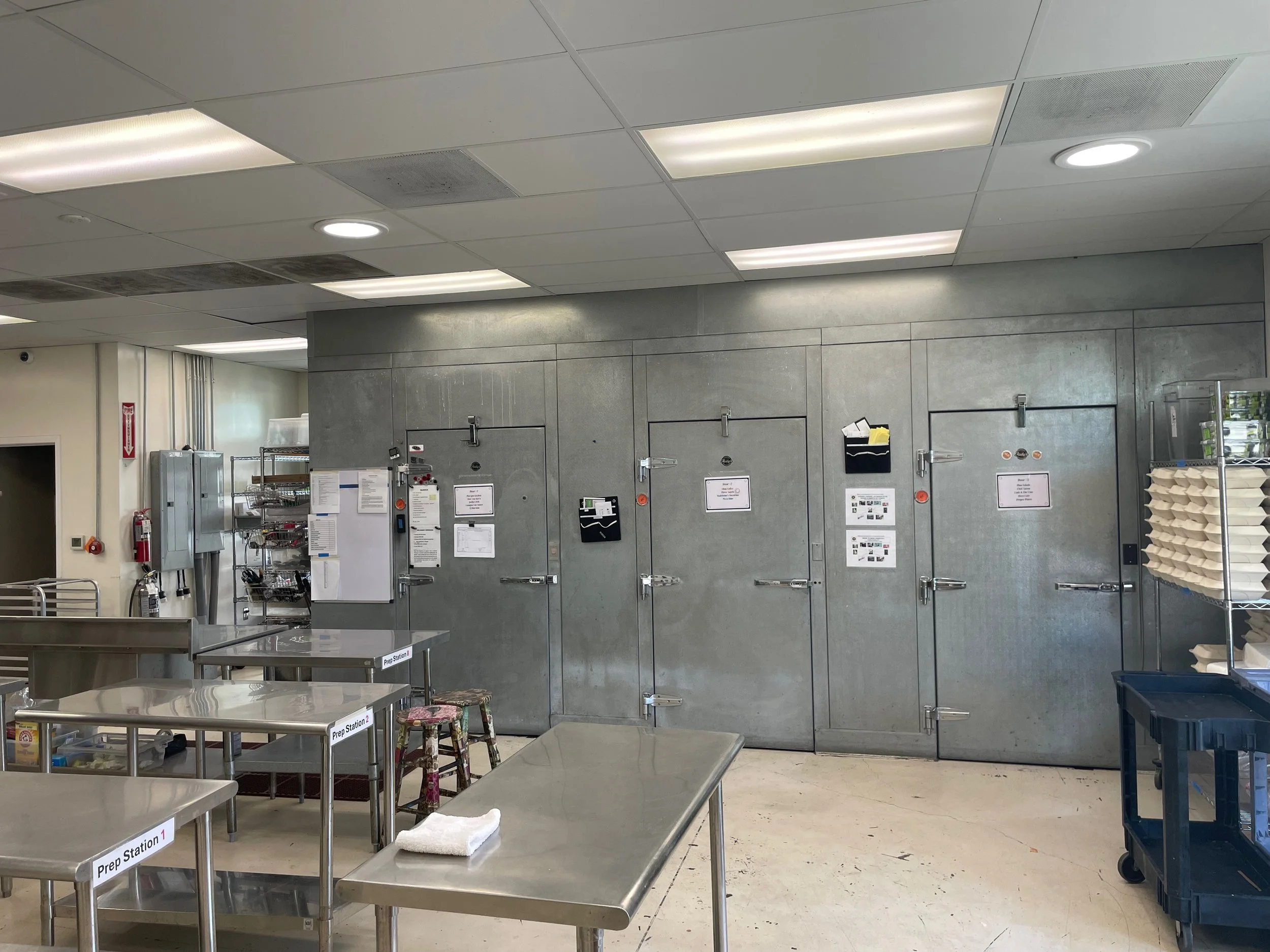 Commercial kitchen prep stations and walk-in cold storage at South Napa Kitchen in Napa