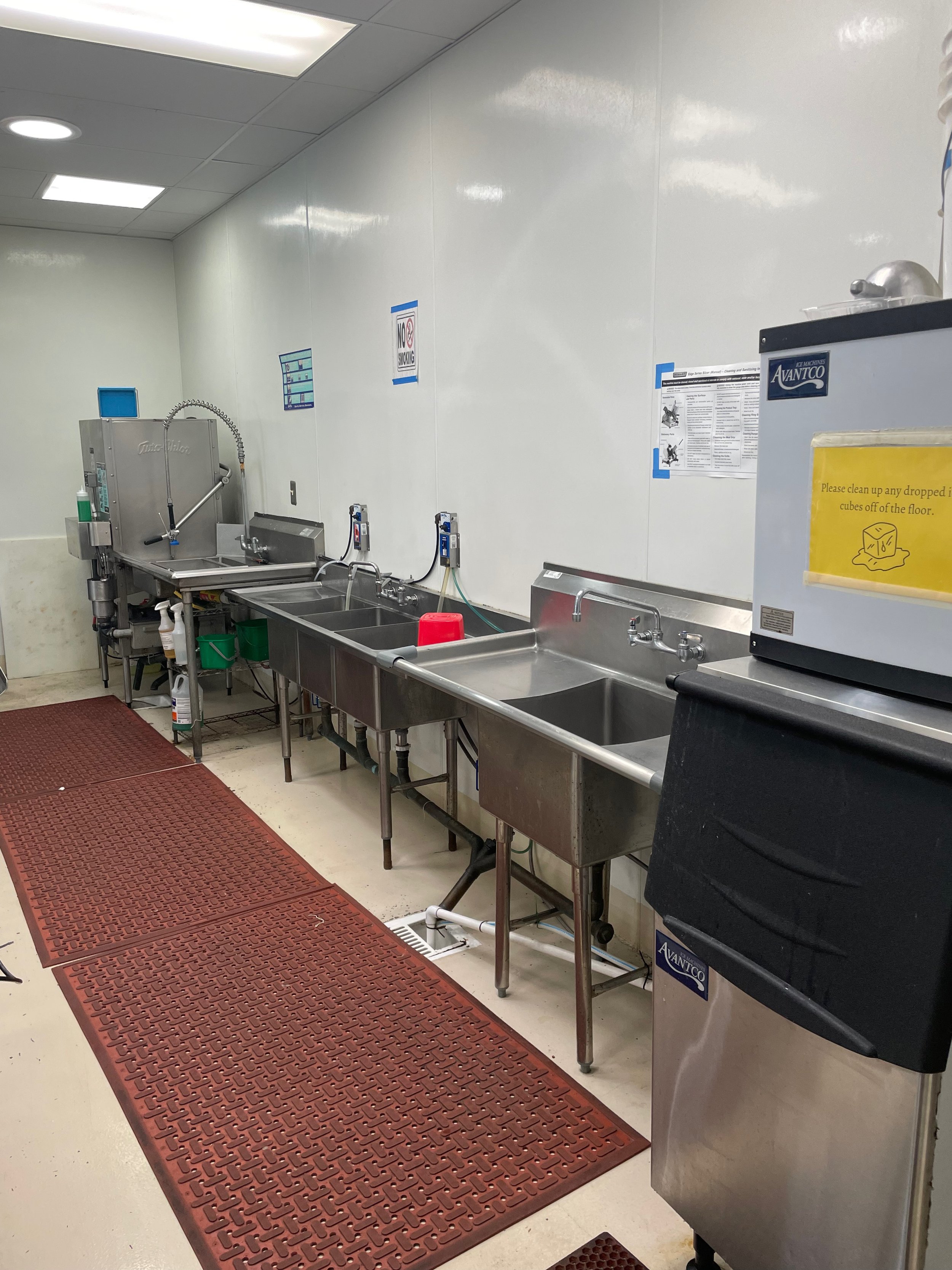 Commercial kitchen ice machines, sinks and dishwashing area