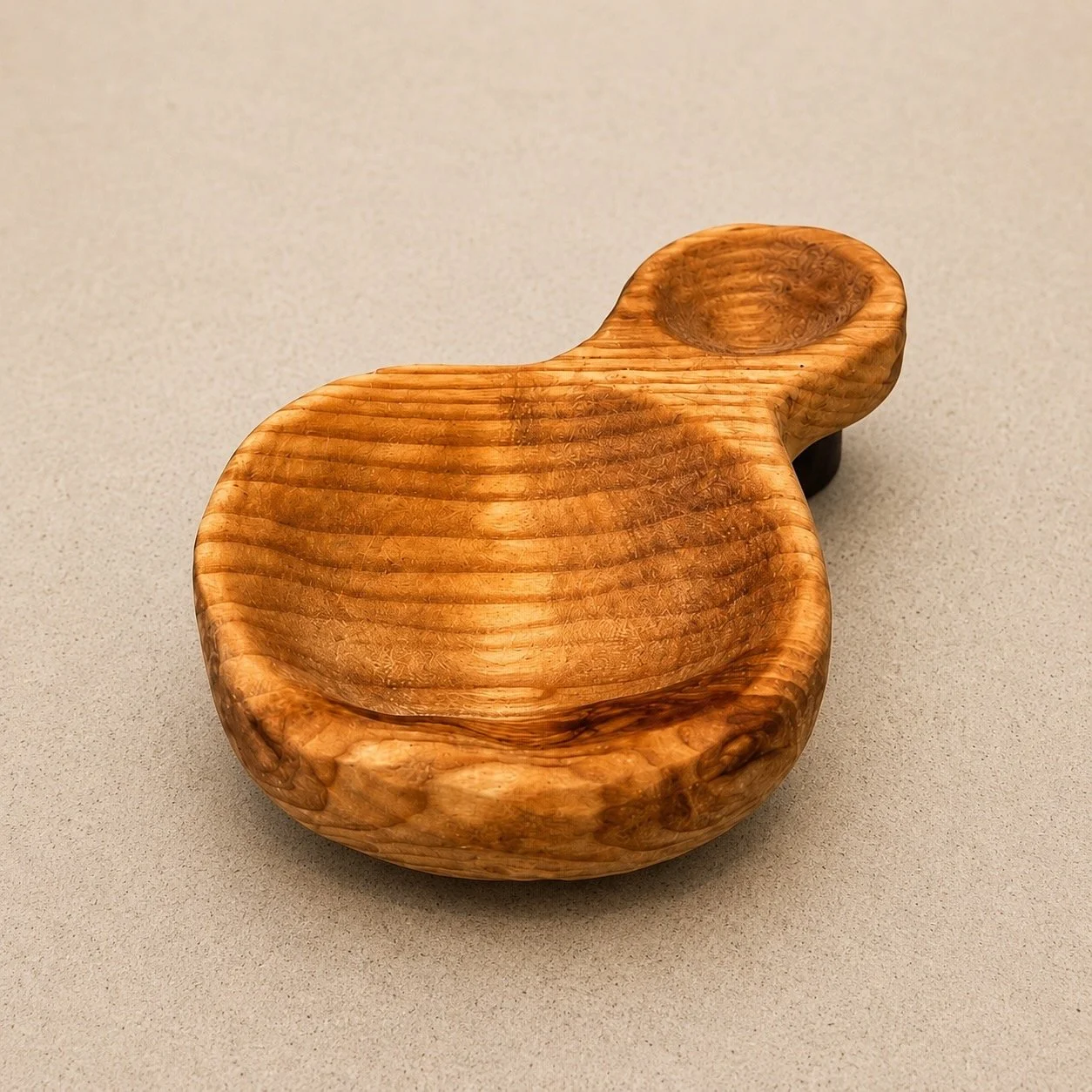 Hand-carved double-ended wooden spoon