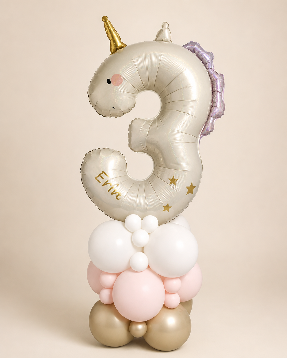 Personalised unicorn number 3 balloon in pearl cream with gold horn and lilac mane, stacked on white, blush pink and chrome gold latex balloons for a girl's 3rd birthday.