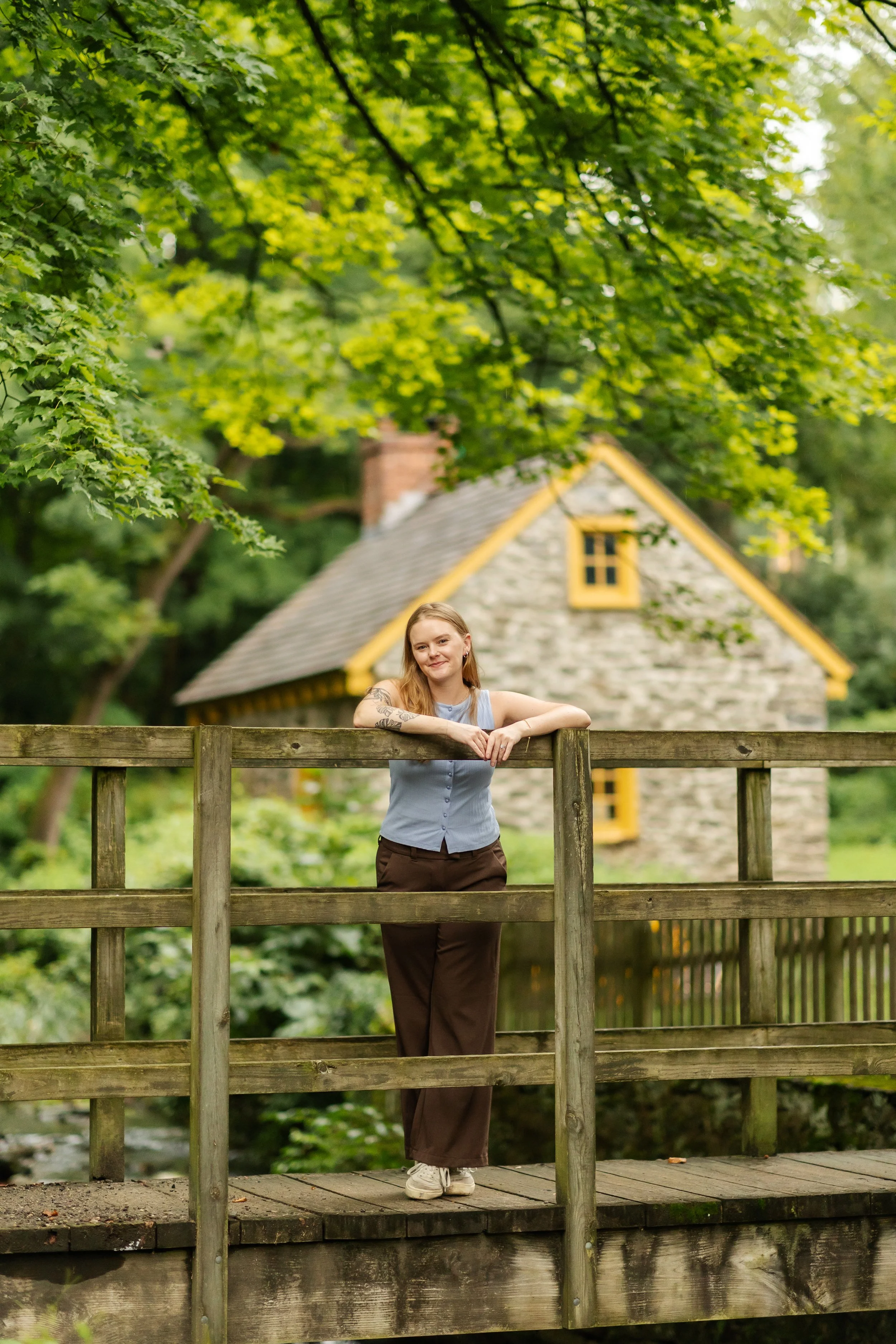 Therapist Natalie Adey standing on a bridge in professional portrait