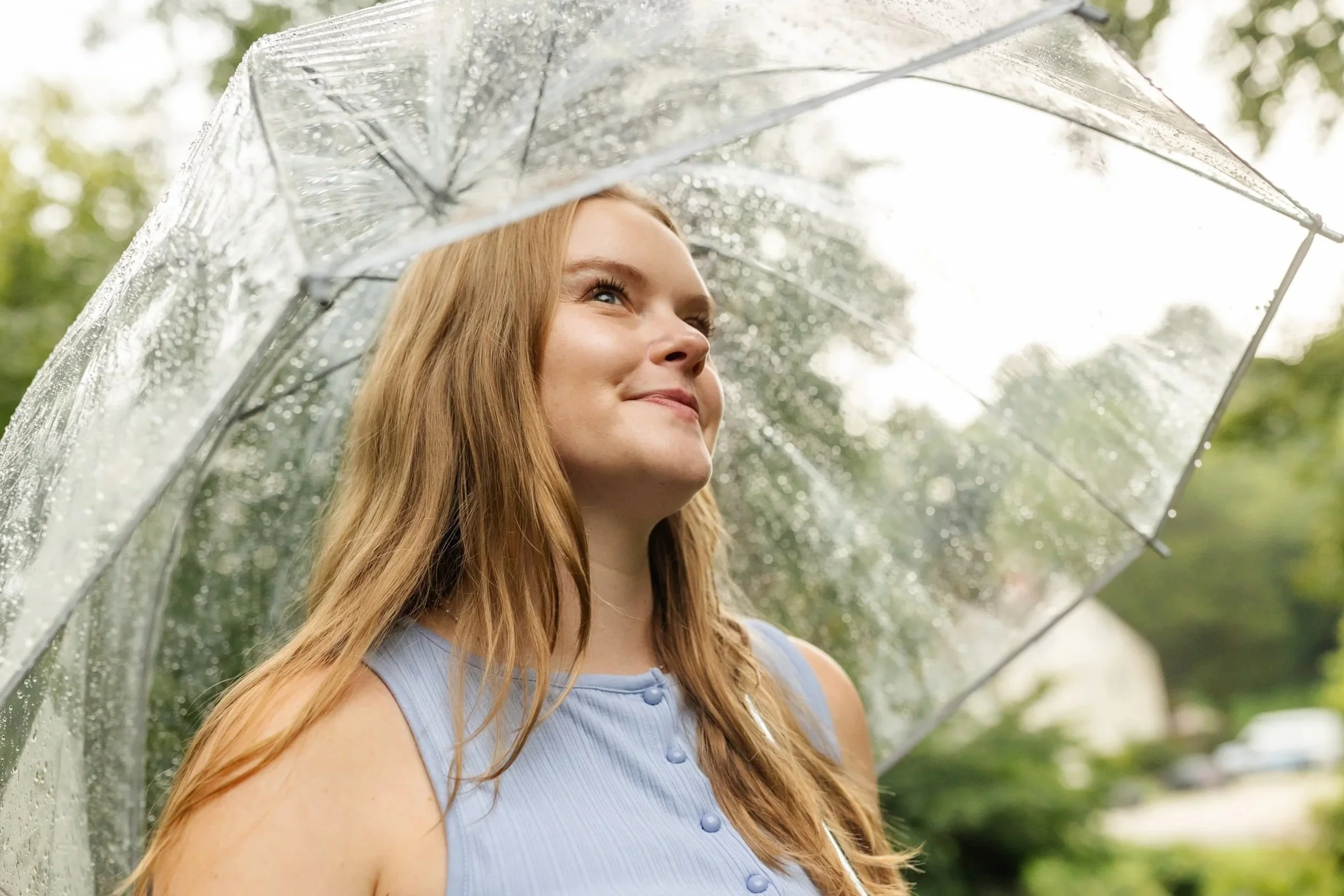 Therapist Natalie Adey smiling outdoors in a headshot