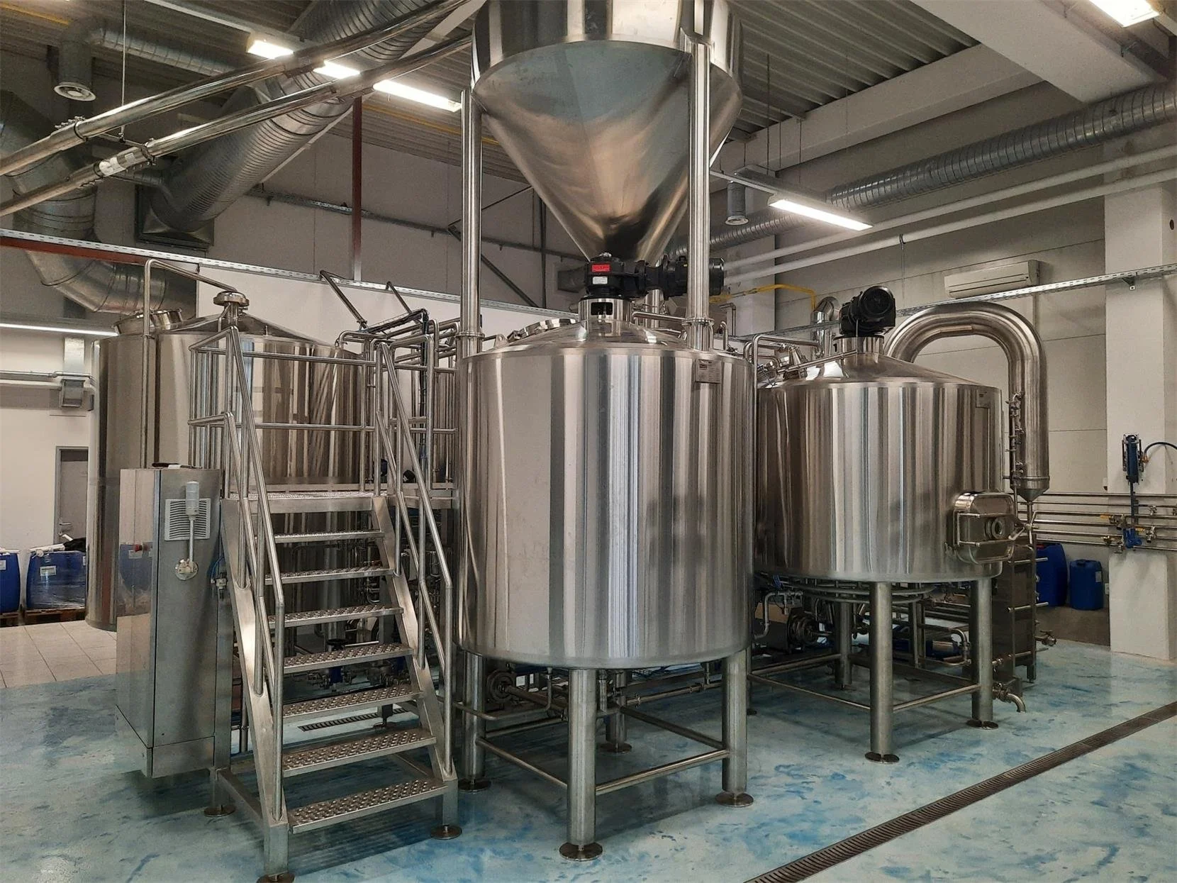 Stainless-steel fermentation and liquid-culture vessels in a production facility