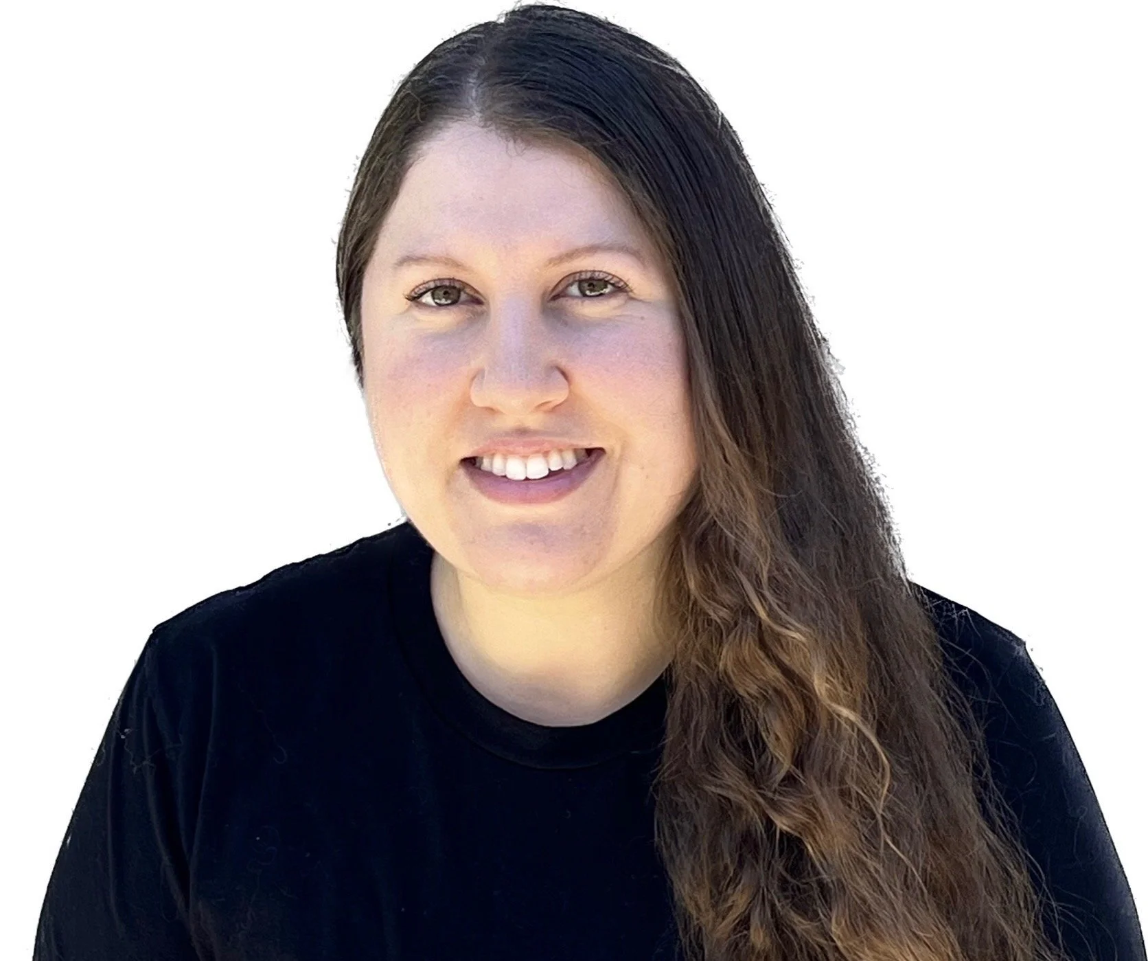 A woman with long brown hair, light skin, and hazel eyes smiling while wearing a black shirt against a white background.
