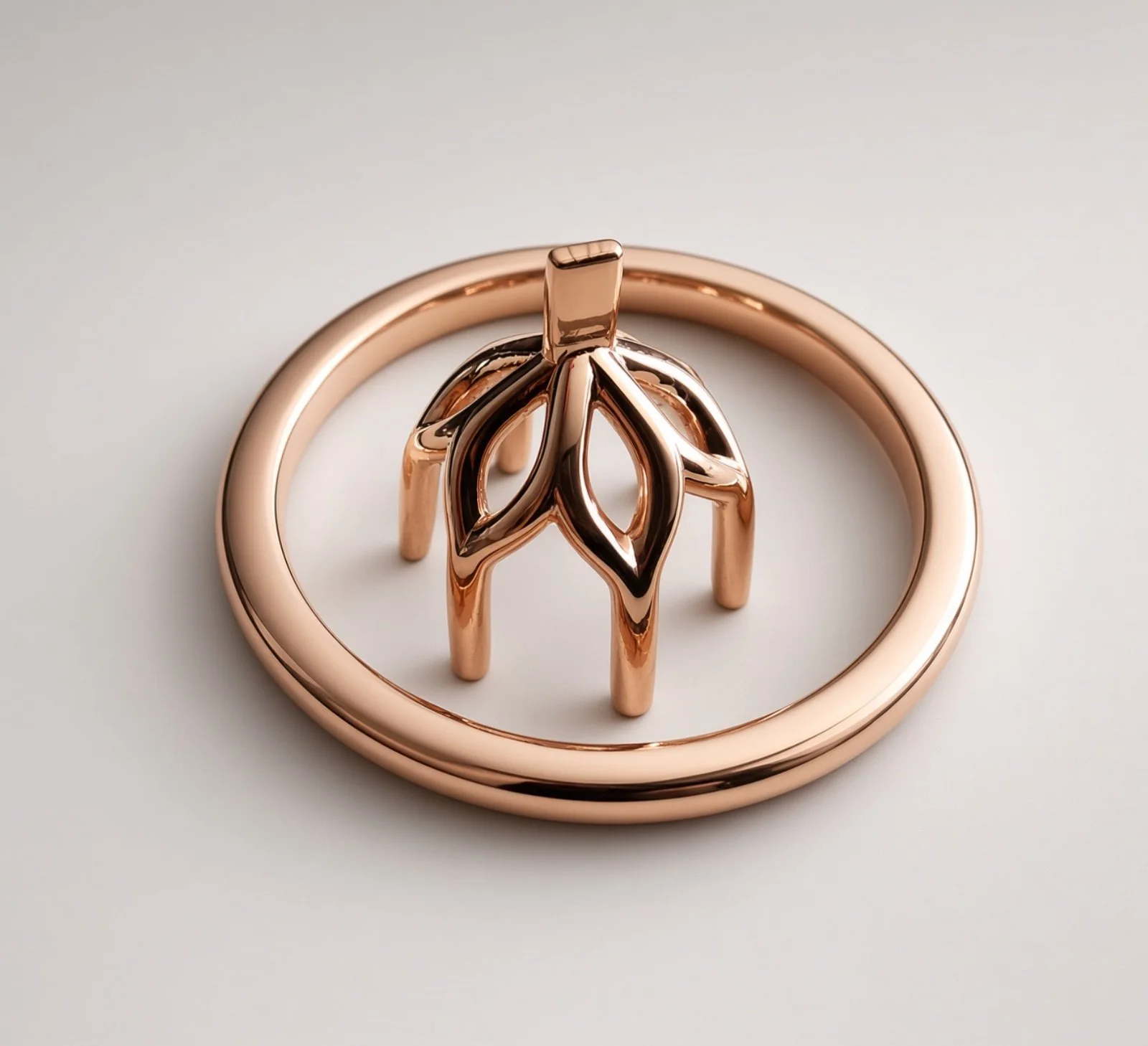 Set of three rose gold rings with unique designs, one large ring encircles two smaller matching rings on a plain white background.