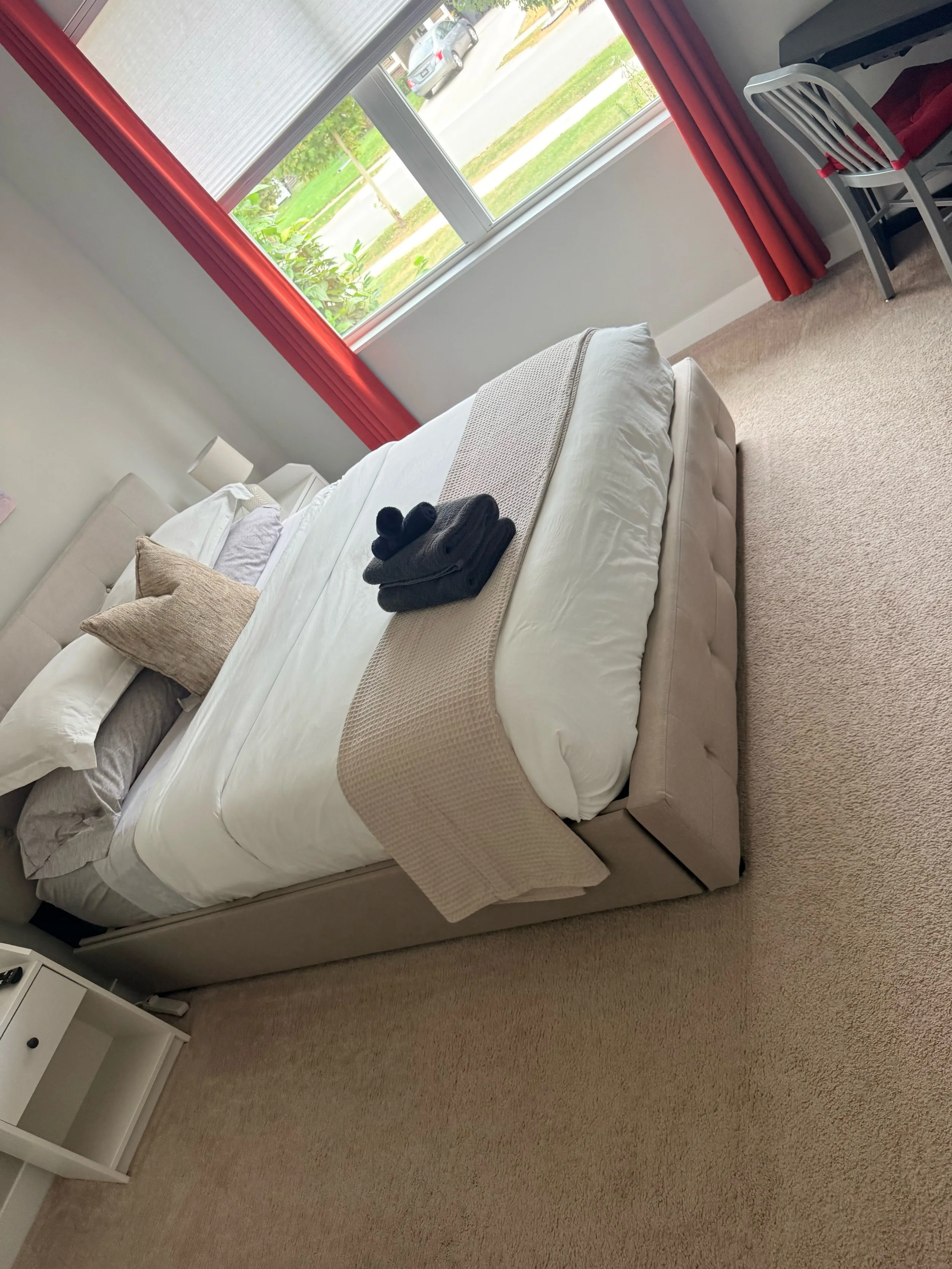 Airbnb bedroom staged with fresh linens and towels after a turnover clean in Pendleton, IN
