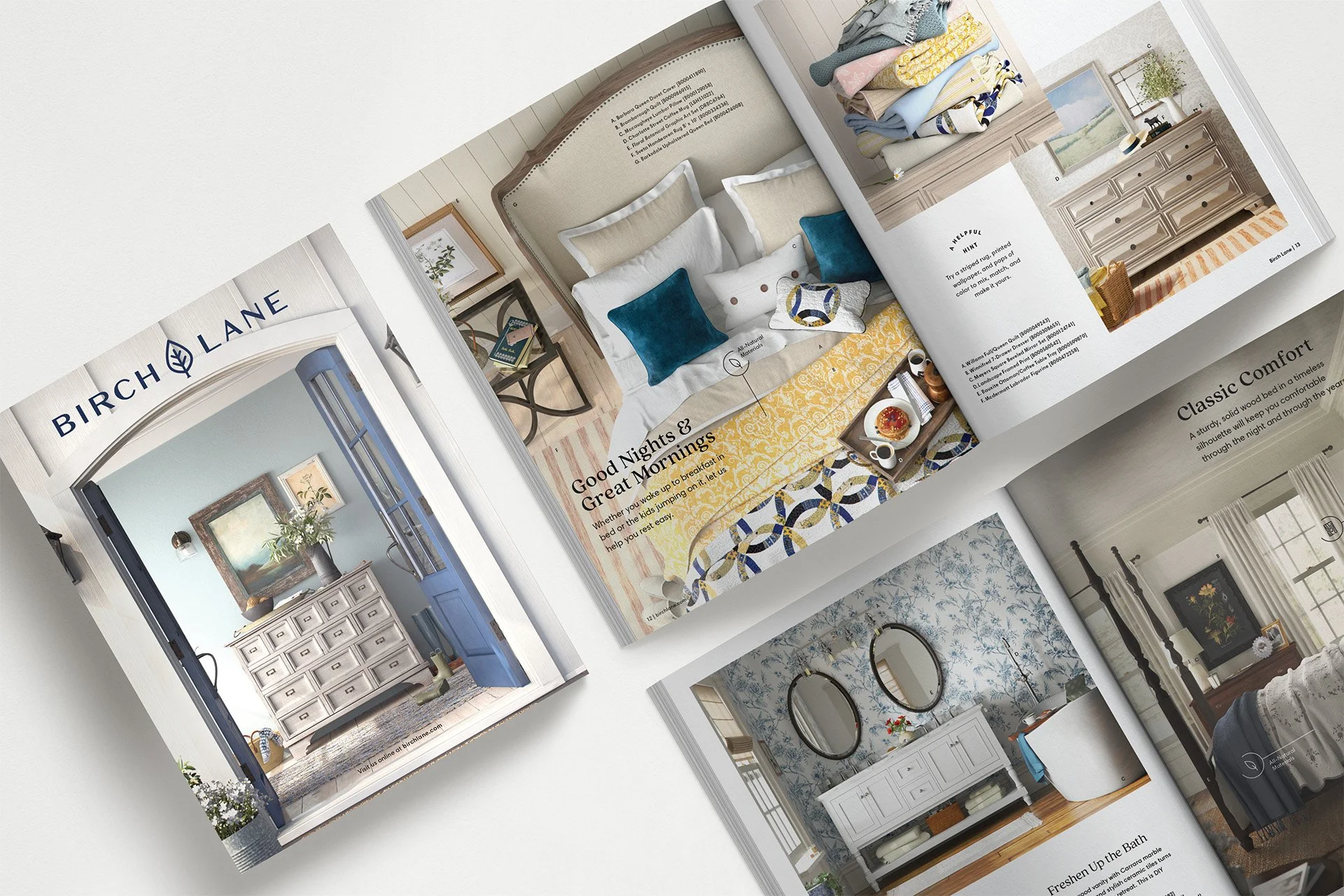 Open home decor magazine displaying a bedroom with a light beige bed, blue and white pillows, a yellow patterned blanket, and a tray with breakfast on it, along with other interior design images.