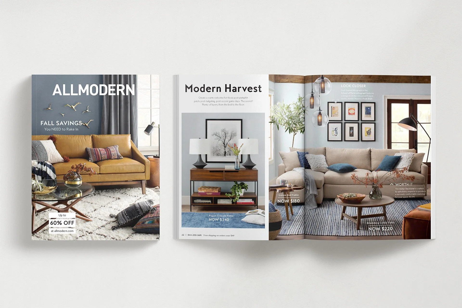 Interior design catalog open to pages featuring modern living rooms with sofas, coffee tables, artwork, and decorative lighting.
