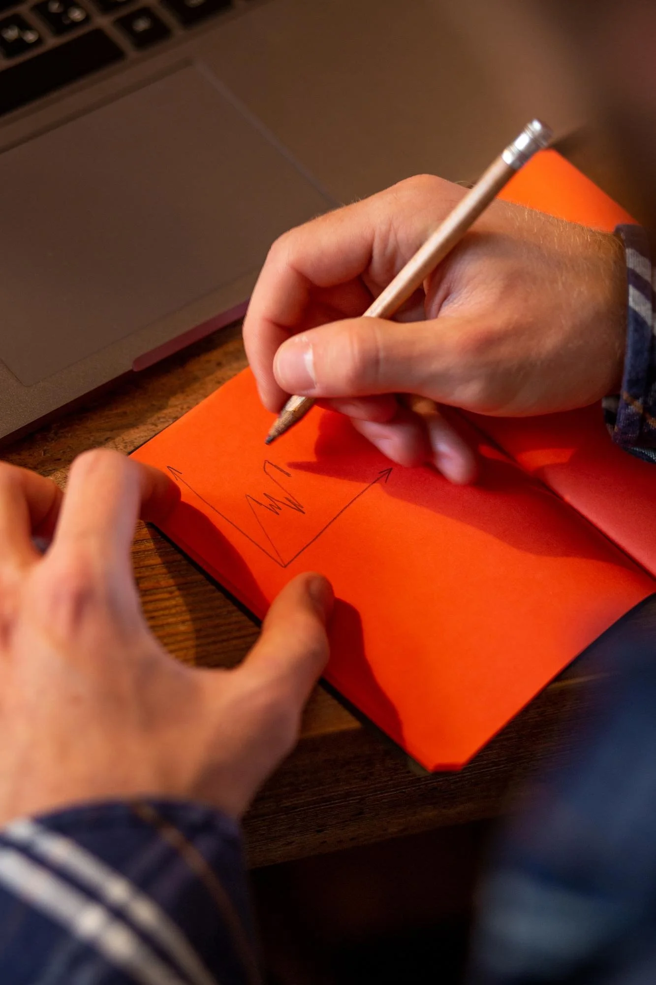 Designer starts to sketch logo ideas