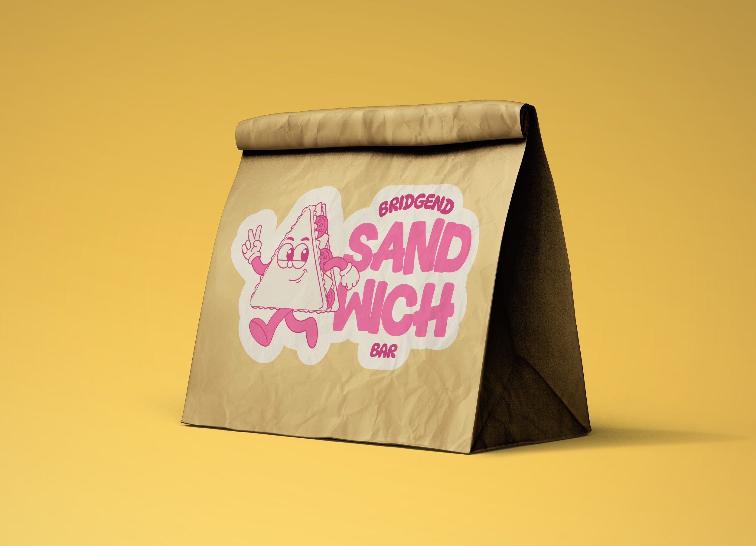 Paper bag with a pink and white logo featuring a cartoon sand wedge character making a peace sign, on a yellow background.