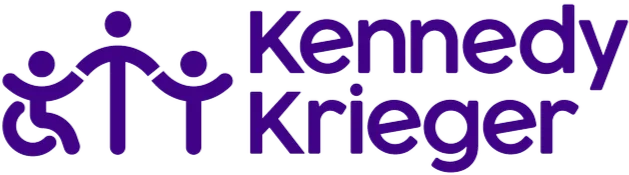 Kennedy Krieger logo with stylized purple icons of two adults, one in a wheelchair, and a child.