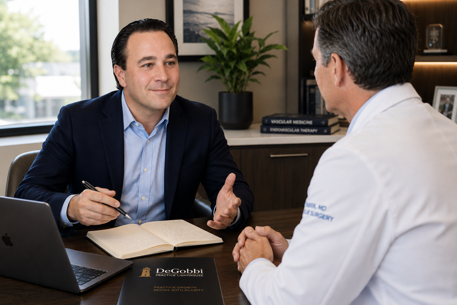 Christian DeGobbi, founder of DeGobbi Practice Lighthouse and physician discussing growth opportunities during an office consultation.