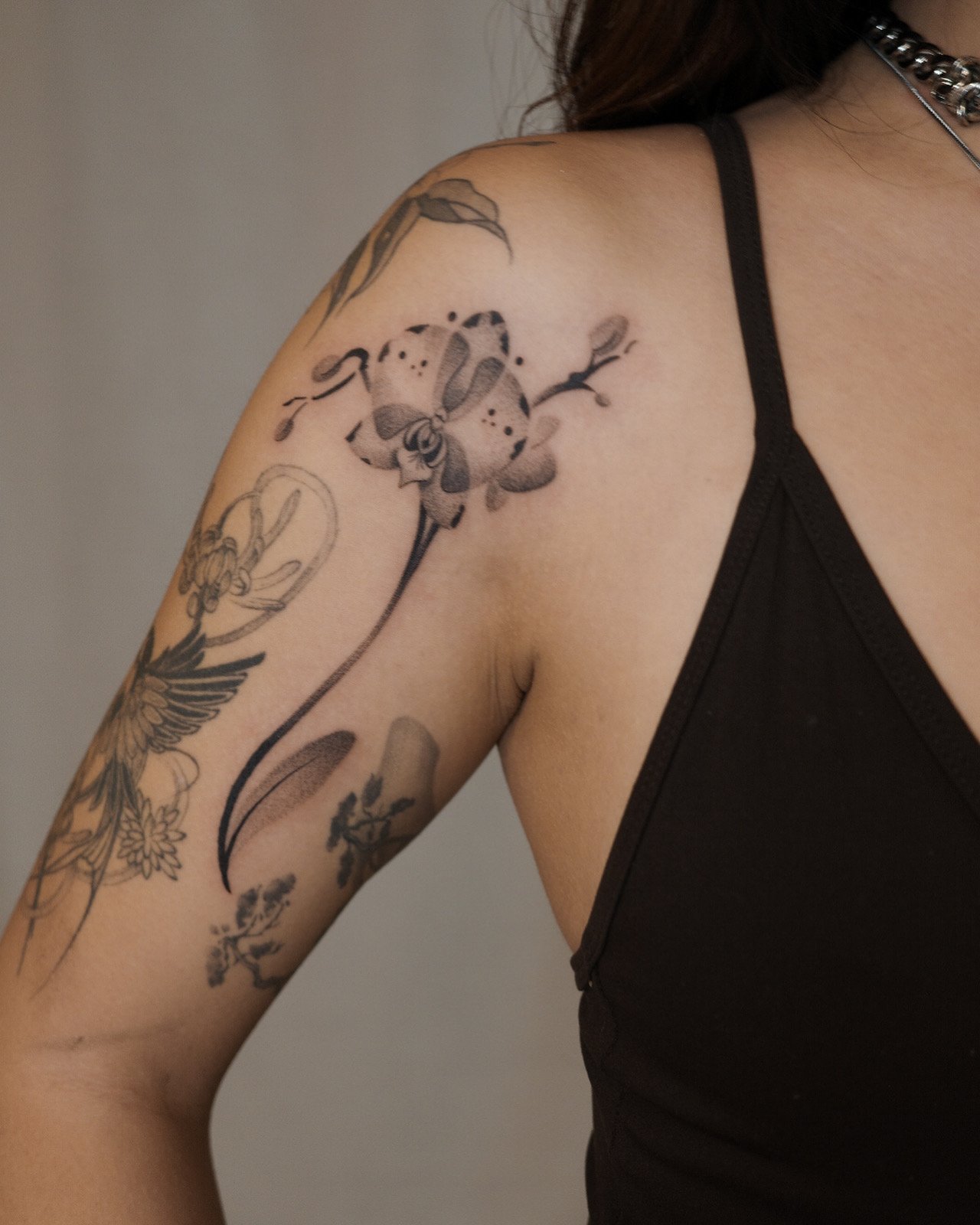 Ornamental orchid tattoo, contemporary and unique  by New York based contemporary tattoo artist, Ginseng Ink.