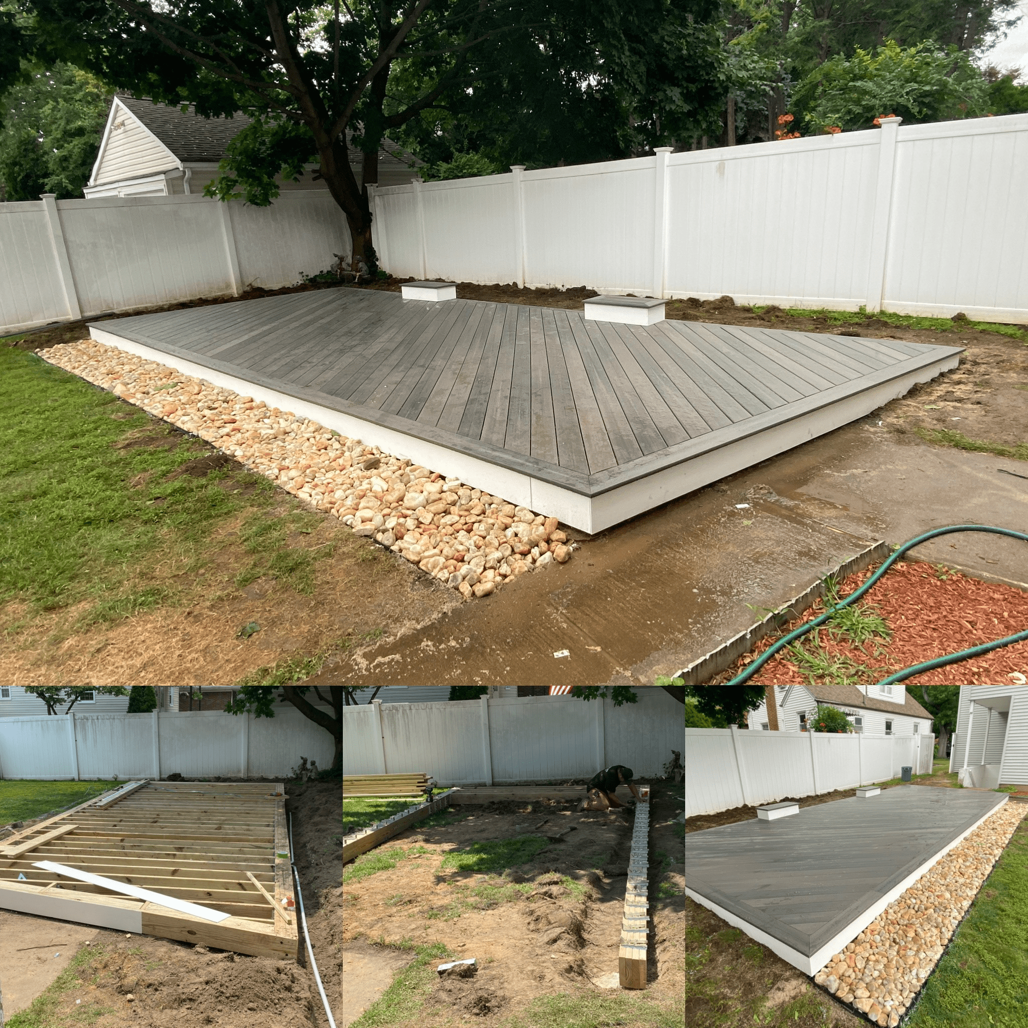 A backyard with a white vinyl fence, a tree, and a raised wooden deck in the process of being built, with construction materials and workers visible.