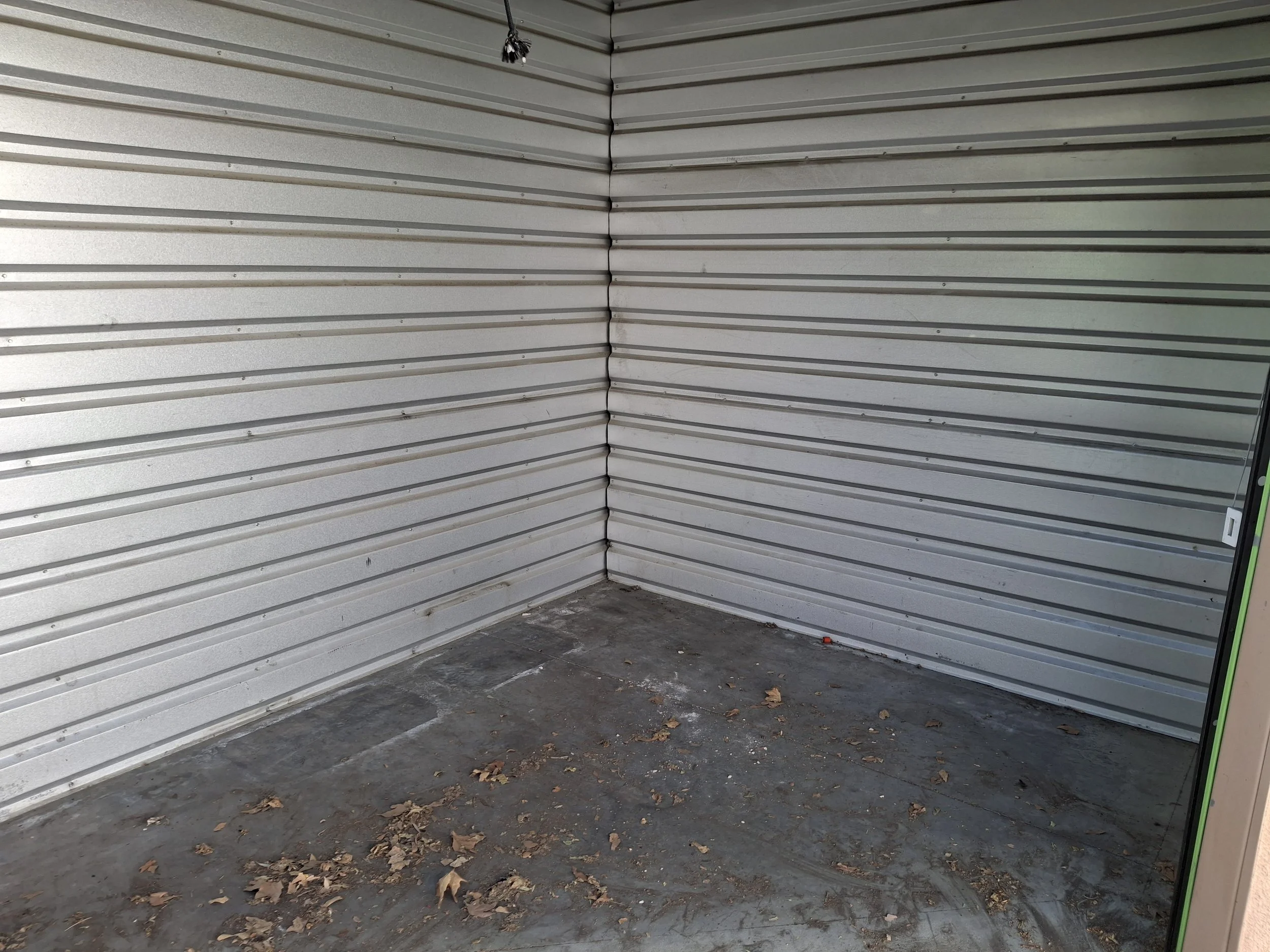 Rented storage workspace where the DIY conversion of Reidar Nettleship's 20-foot Isuzu NPR commercial box truck into an off-grid RV and mobile storytelling studio began.