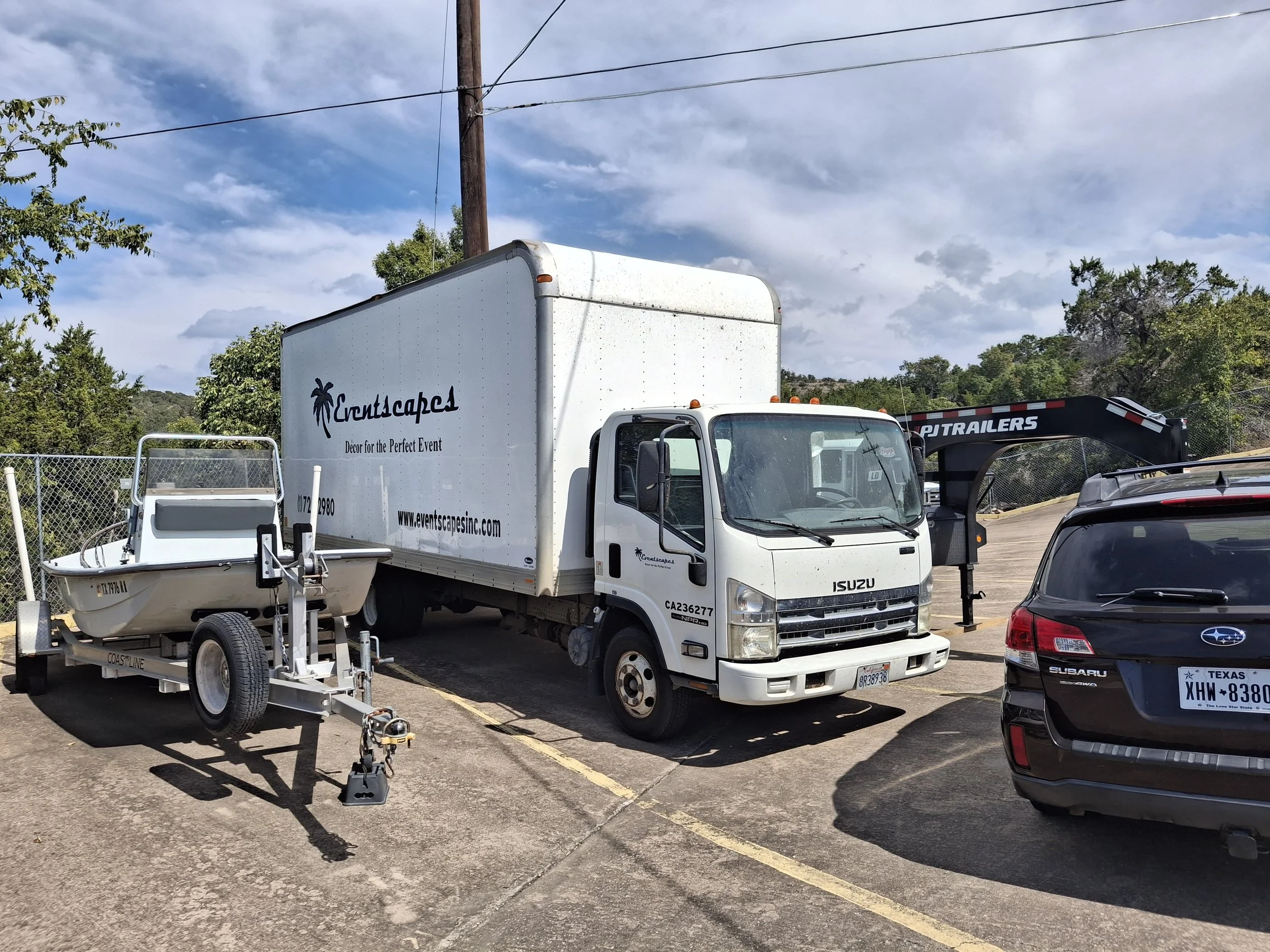 Early stage of a DIY 20-foot Isuzu NPR box truck conversion showing the commercial truck before renovation into a mobile studio, stealth RV, and full-time travel vehicle.