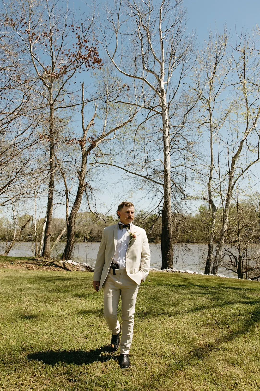 groom in tan suit
