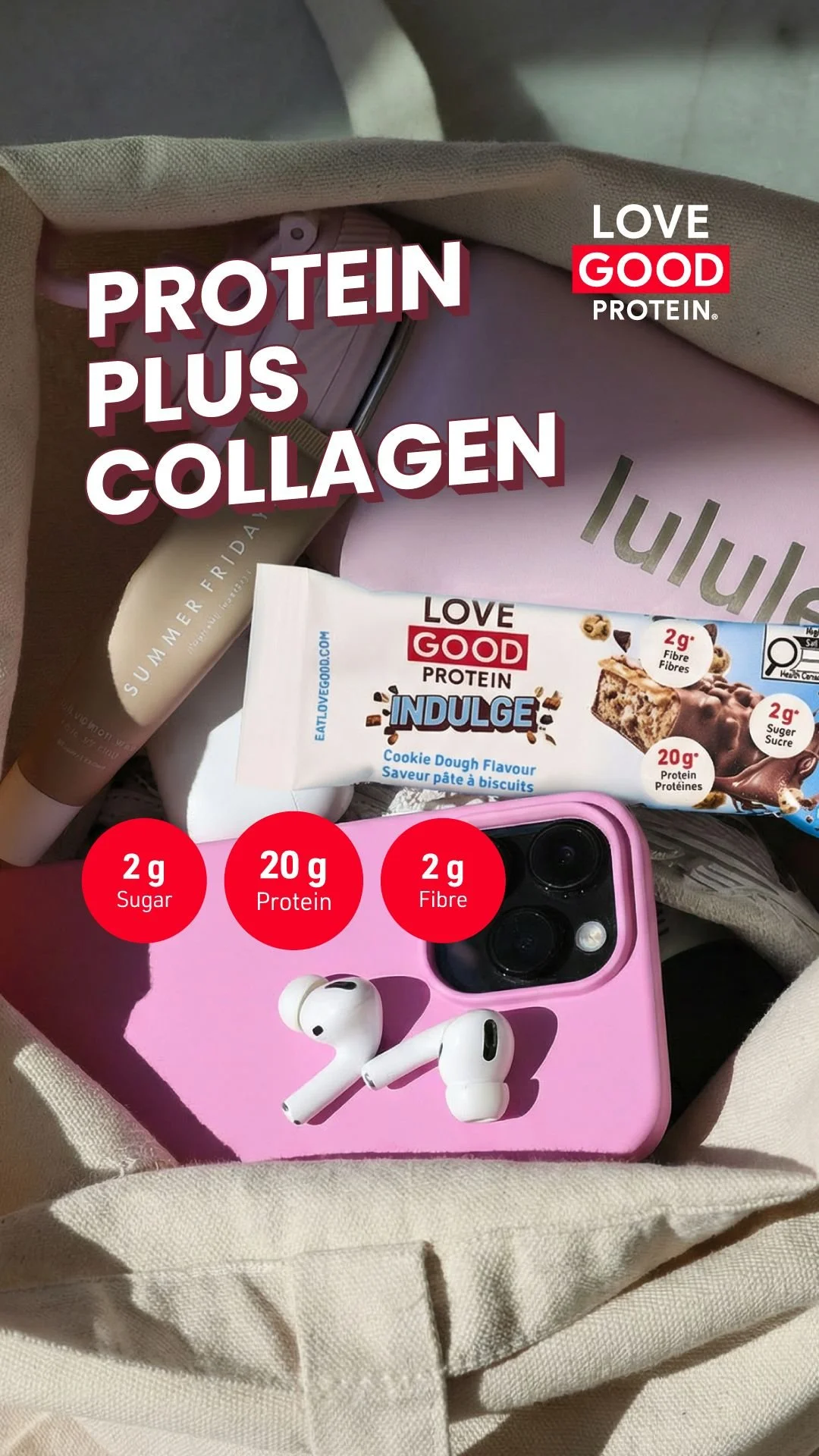 Lifestyle flat lay of a Love Good Protein Plus Collagen bar in a tote bag with phone and AirPods, showing 2g sugar 20g protein 2g fibre