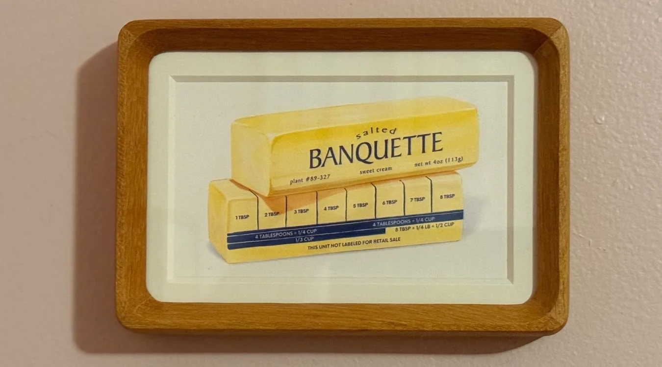 Illustrated salted butter stick package labeled Banquette with tablespoon measurement guide
