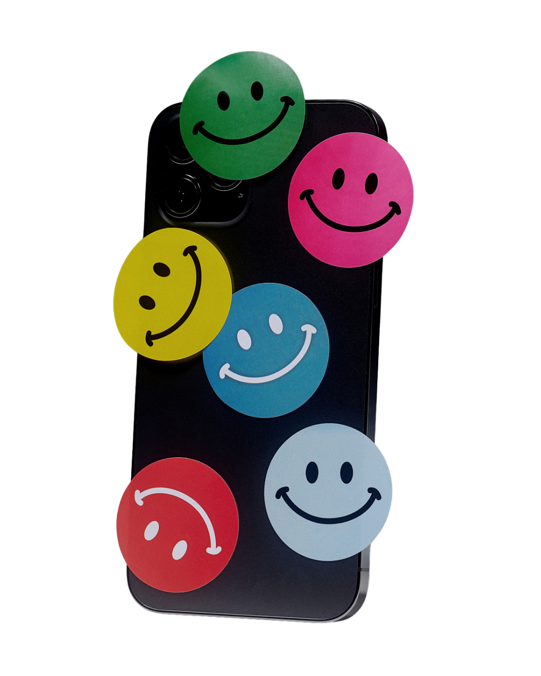 Six colourful smiley face stickers arranged on the back of a black smartphone