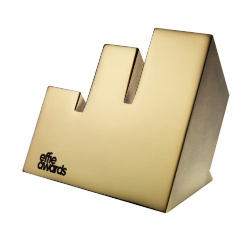 Effie Awards trophy with a large upward arrow design and the Effie Awards logo on the front.