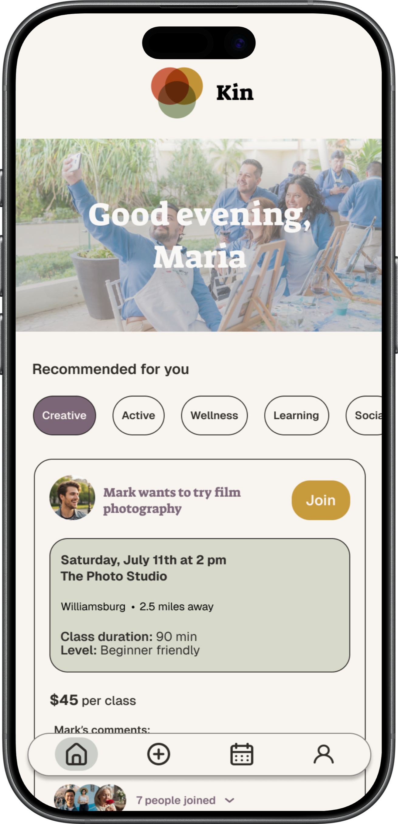 A smartphone screen showing a social app with a group of people painting outdoors, the app greeting Maria and offering activity recommendations. The top logo is multi-colored and reads "Kin."