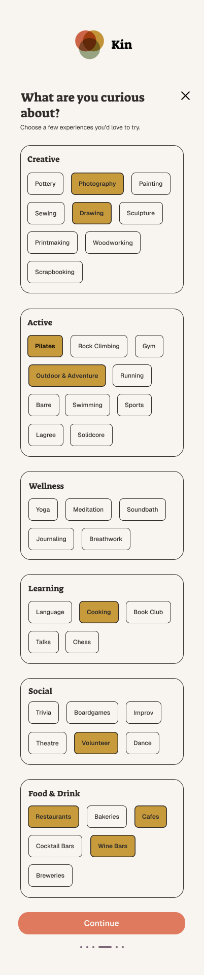 A mobile app screen with the logo 'Kin' at the top, prompting users to choose activities they would love to try, categorized into Creative, Active, Wellness, Learning, Social, and Food & Drink options, with some options highlighted in brown and a red 'Continue' button at the bottom.