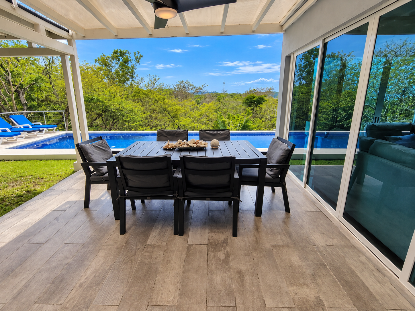Modern Tropical Patio by the Infinity Pool.png