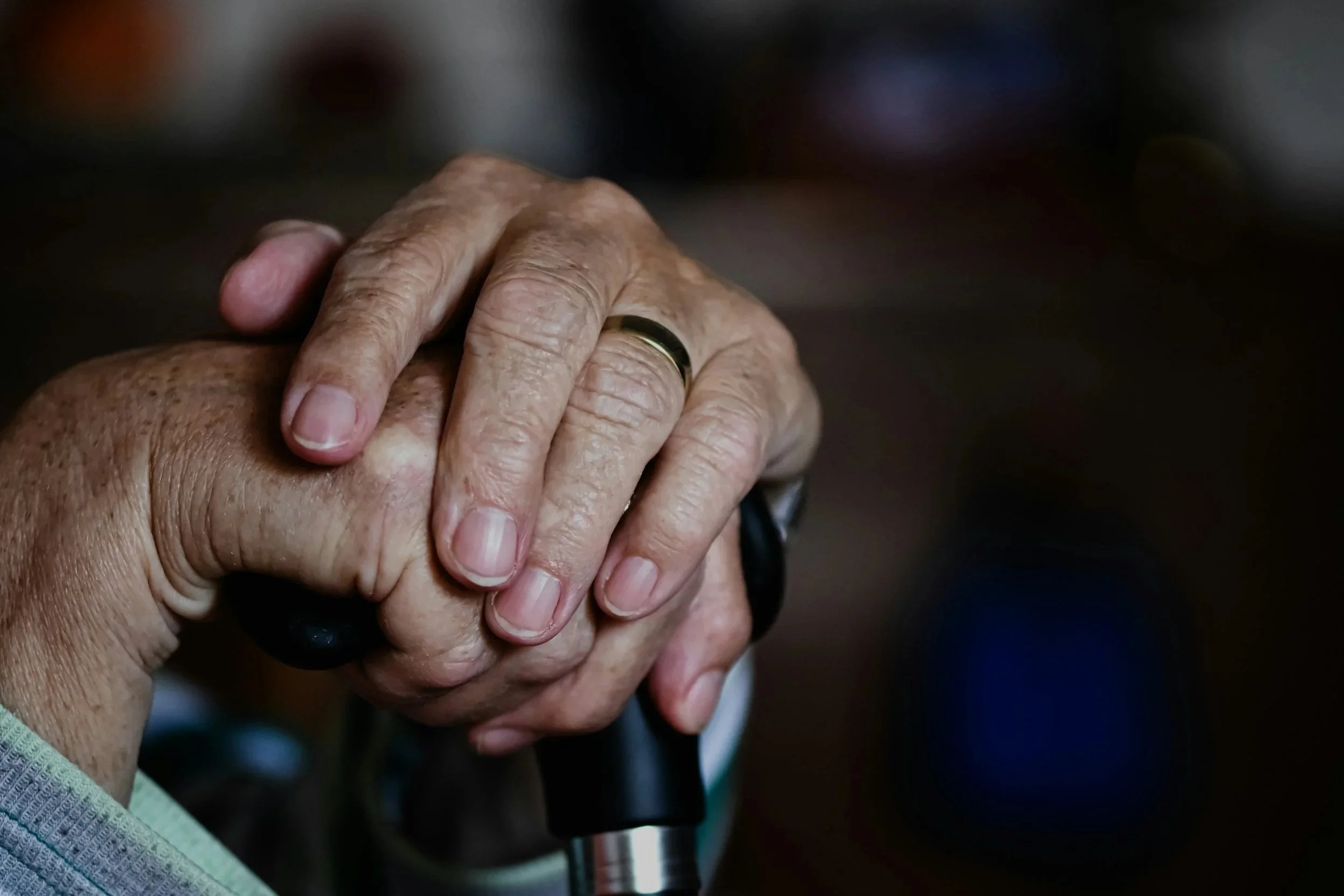 Image of a hand on a cane