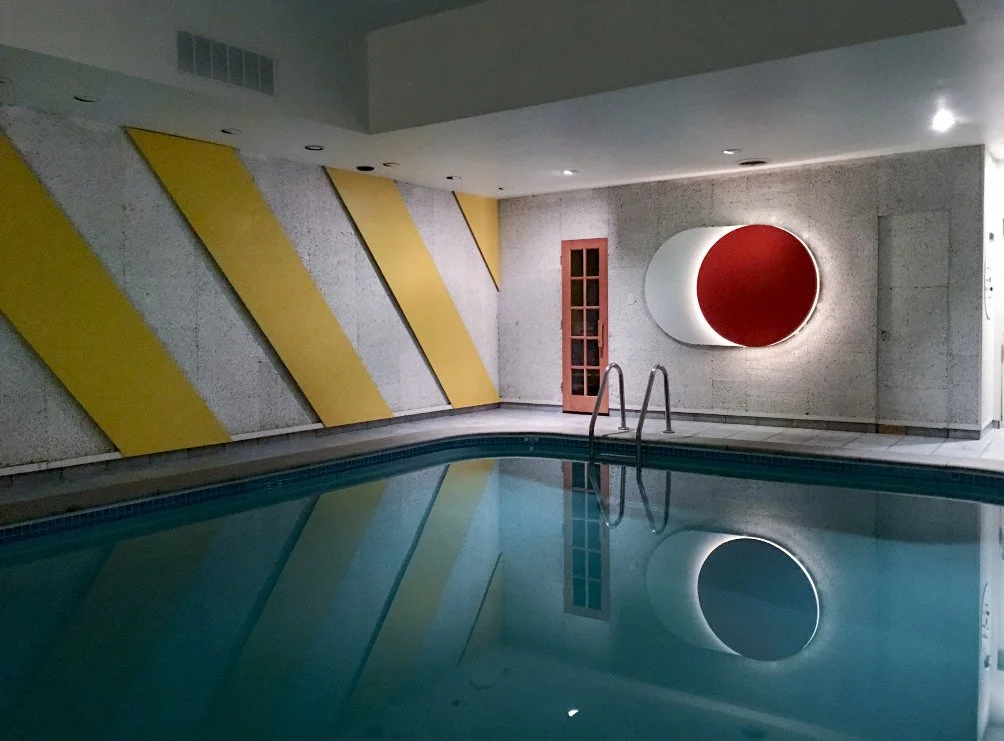 Supergraphics for a basement pool at a private residence, CA, 1967. Walls with yellow
porcelain enamel diagonal stripes, poolside furniture in black and white porcelain
enamel, lighting and 3D lighting fixtures, including mirrors and neon