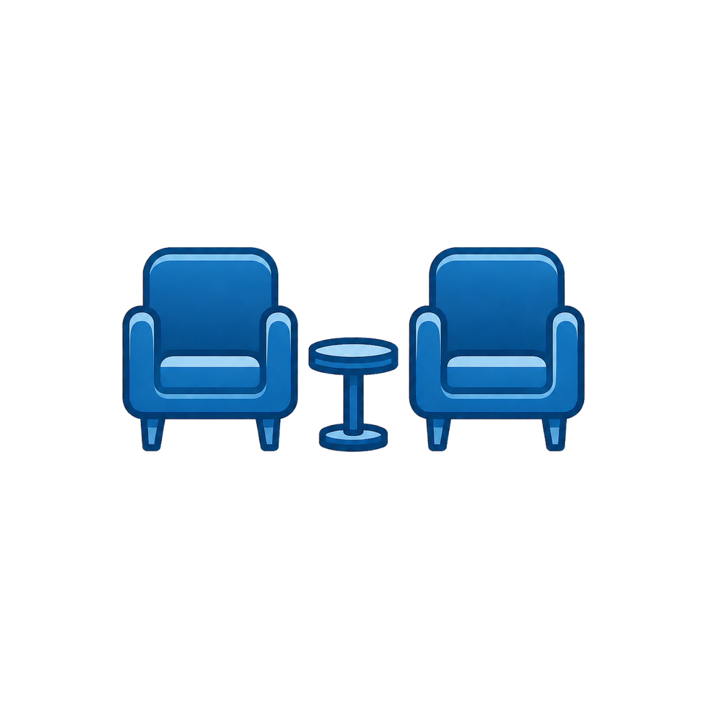 Two blue armchairs with a small round blue side table between them.