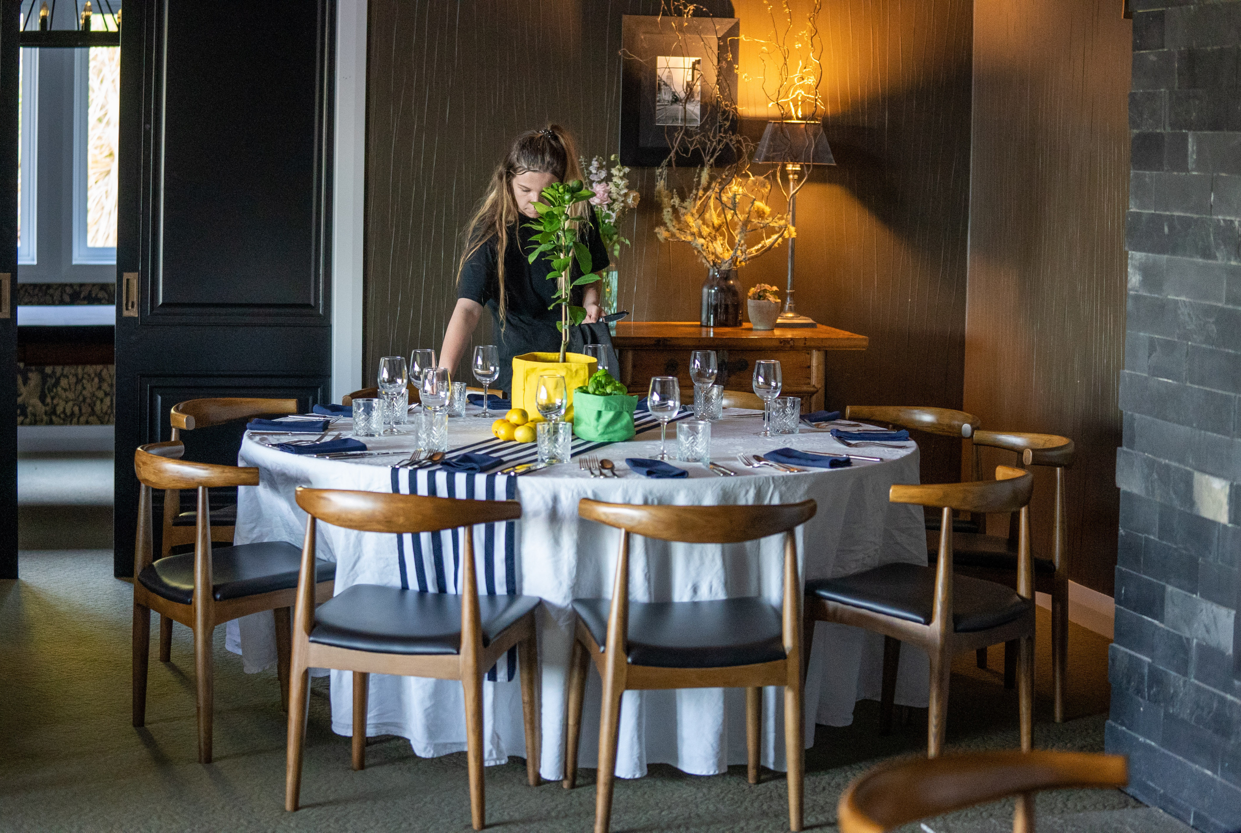Dining room at Woodhouse Mountain Lodge in Matakana set for an intimate group meal.