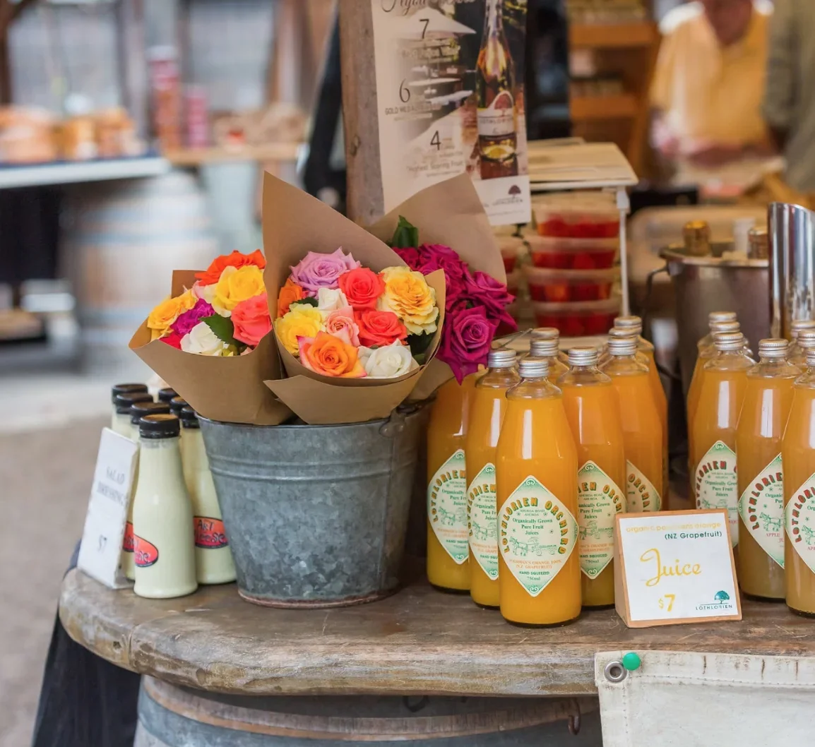 Fresh flowers and locally made produce at a Matakana market near Woodhouse Mountain Lodge.