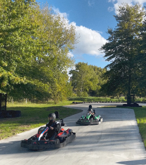 Electric go-kart racing at E-Volt Racing Matakana near Woodhouse Mountain Lodge.