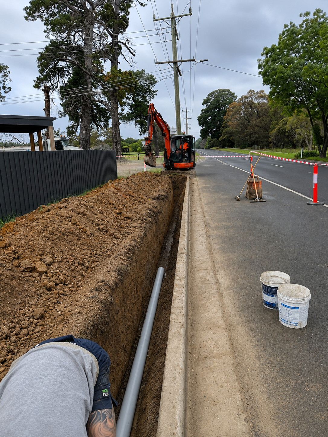 Excavation and underground drainage pipe installation for a residential development.