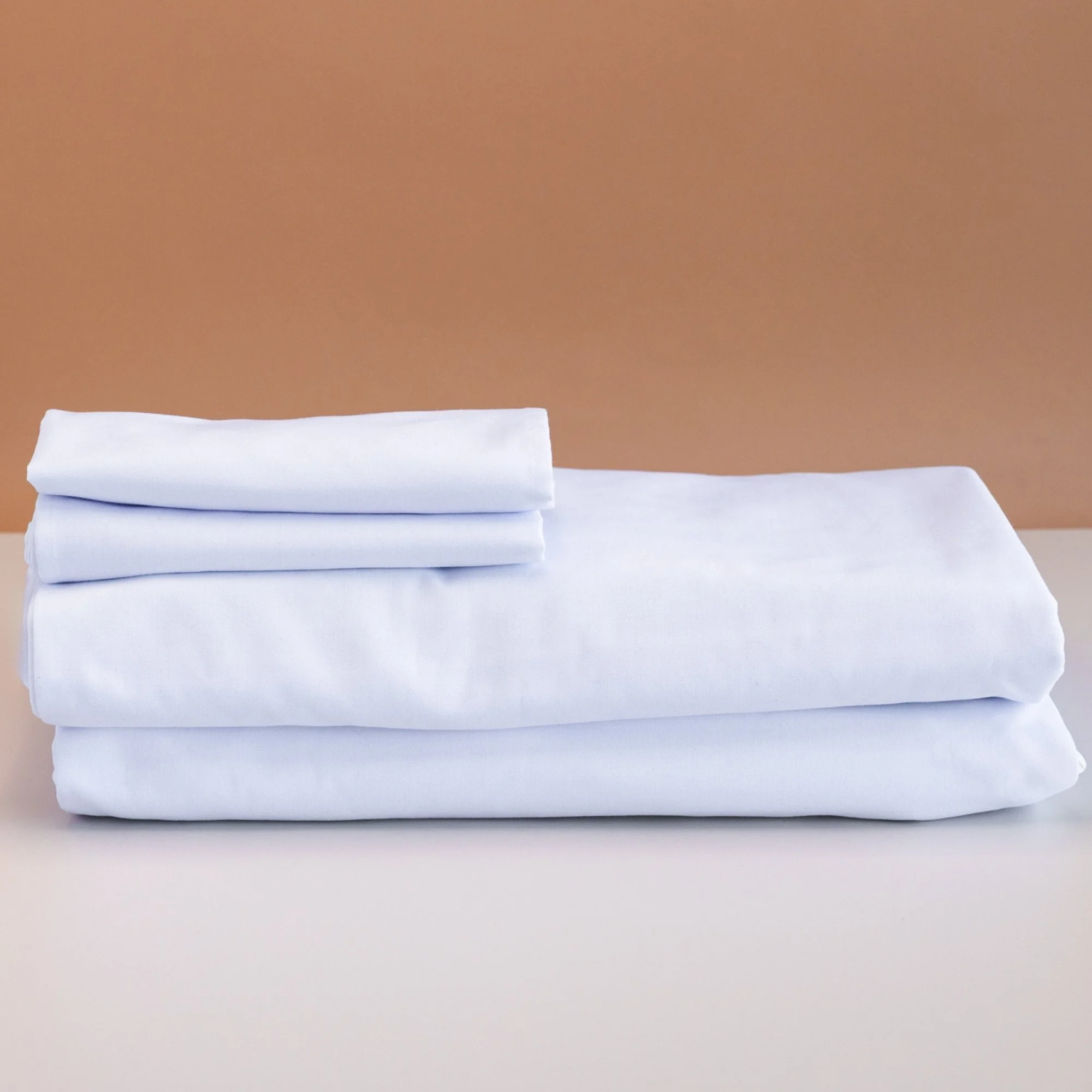White ring spun polyester tablecloth on event table — bulk table linen NZ