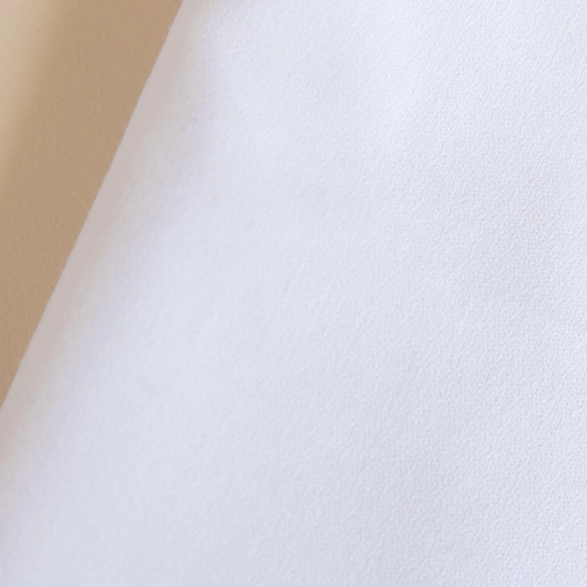 Close-up of a white textured ova White Event  Table Linen