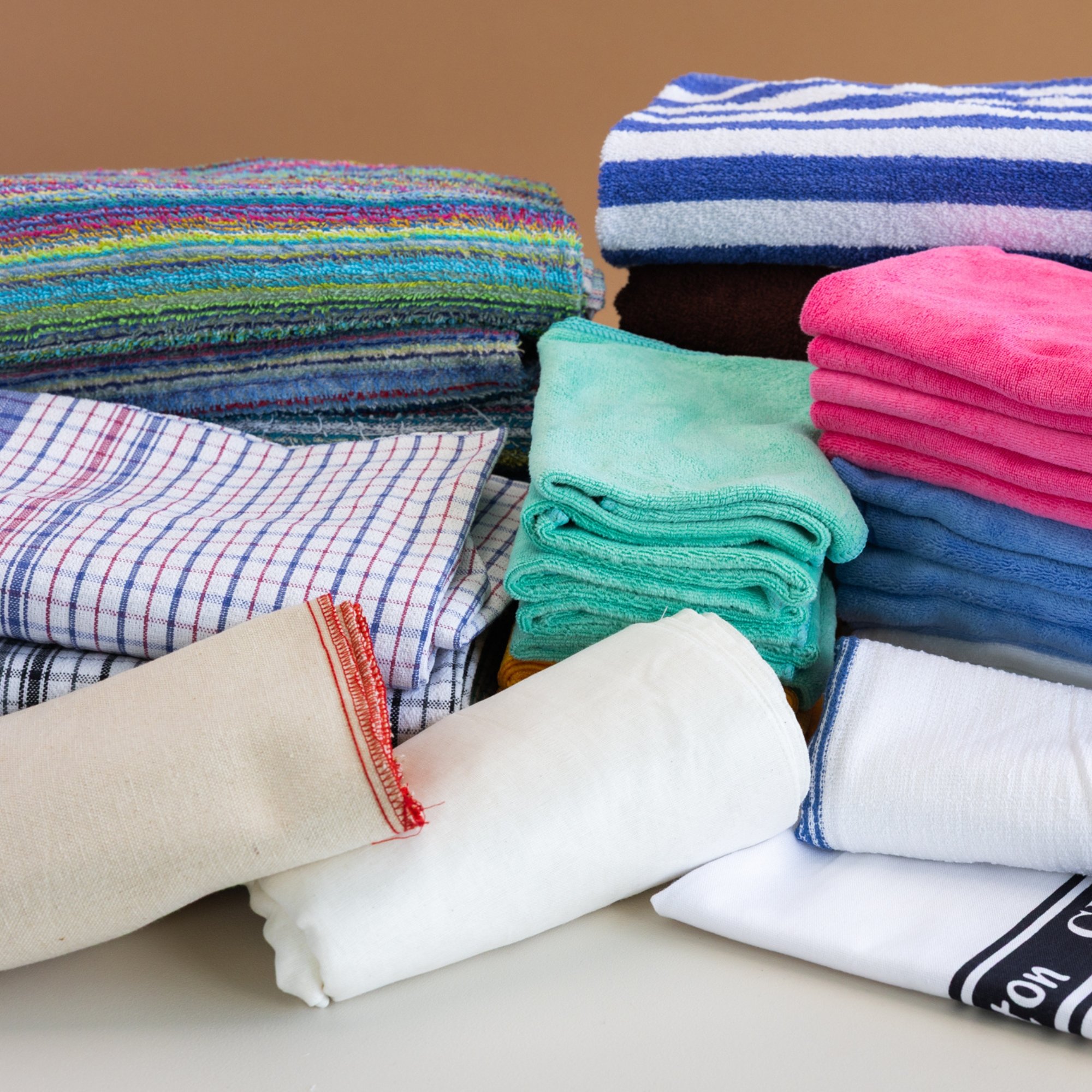 Stacked commercial kitchen and cleaning cloths supplied by Ritex