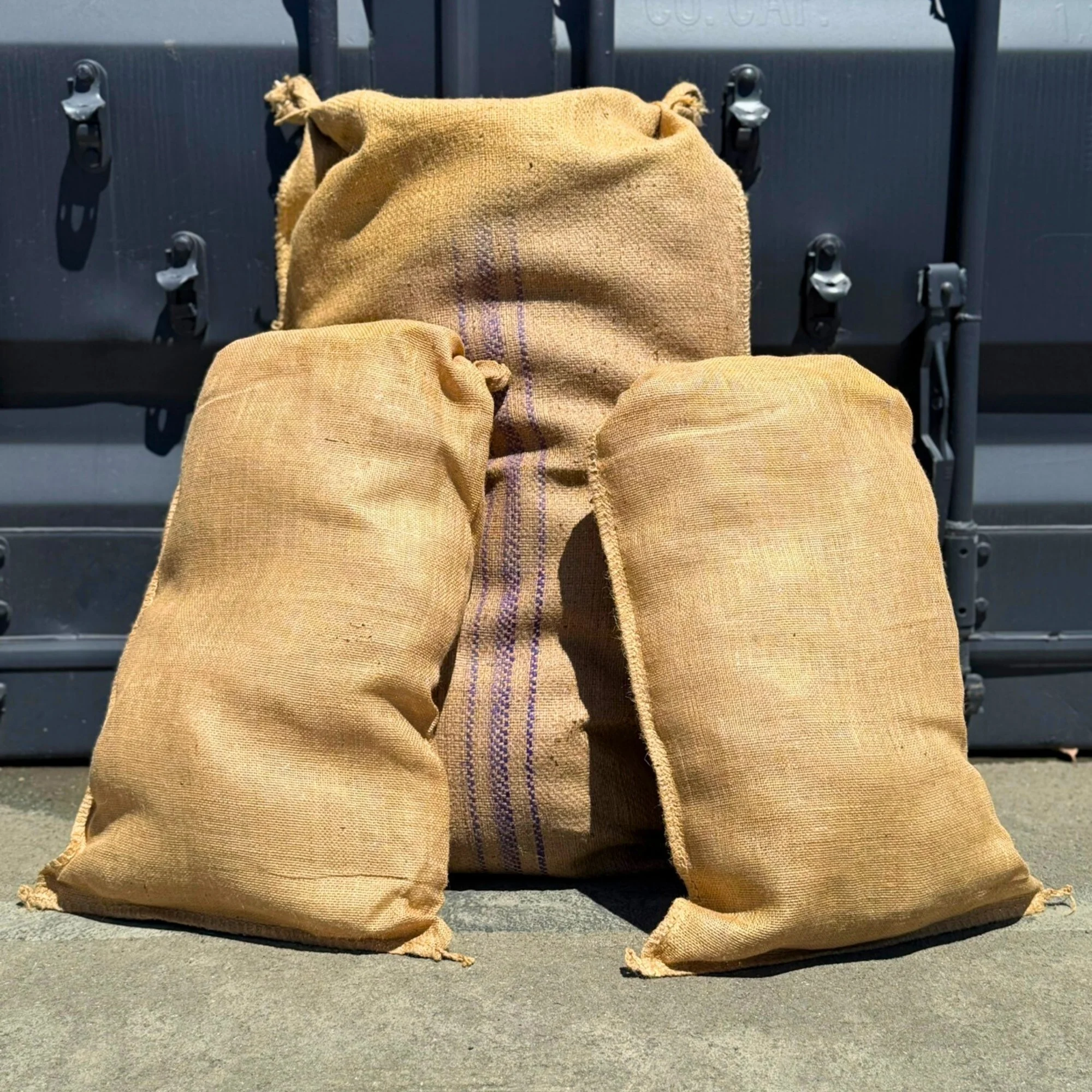 Three hessian and jute sacks.