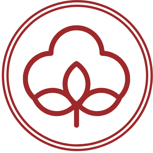 A circular logo with a stylized leaf and plant design in dark red and white outline.